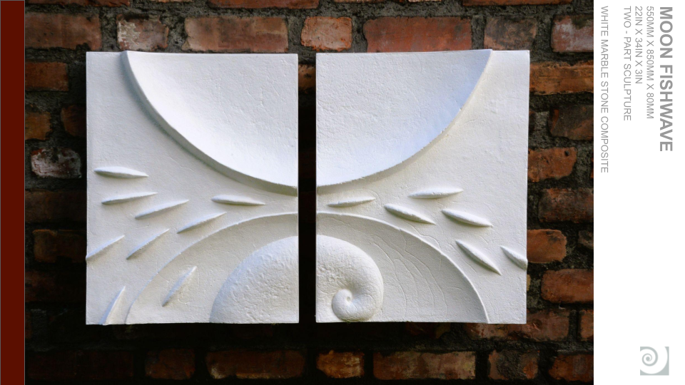 Two square white marble stone composite panels with raised abstract wave and spiral designs, mounted on a red brick wall.