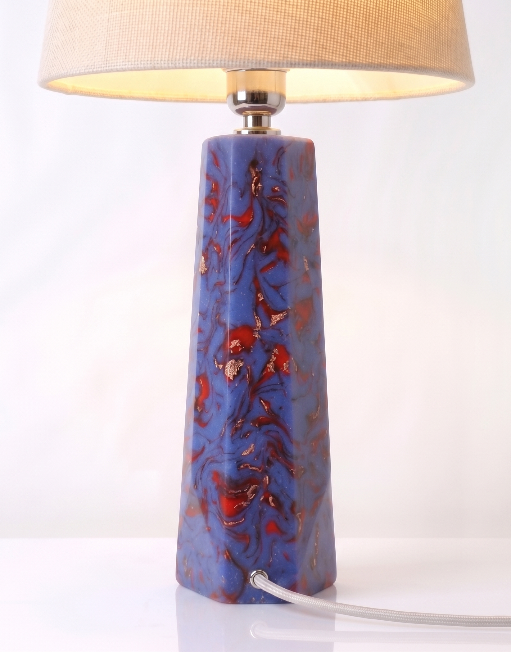 Blue and Red Swirl Lamp Base complete with its shade, shown against a pale background