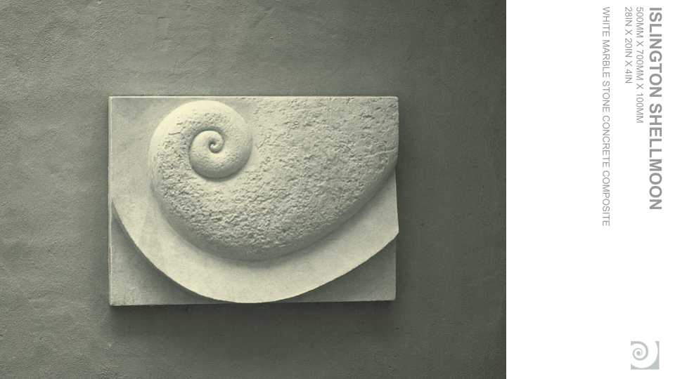 A white concrete sculpture of a nautilus shell on a square base, displayed against a gray wall.