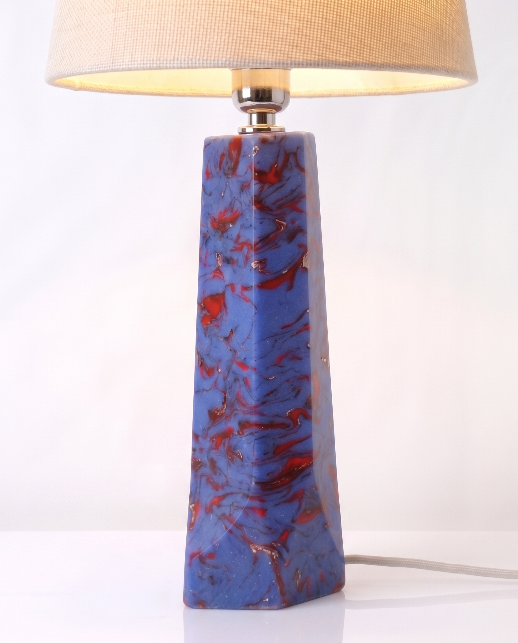 Blue and Red Swirl Lamp Base seen closer, the marbled column rising to a linen shade