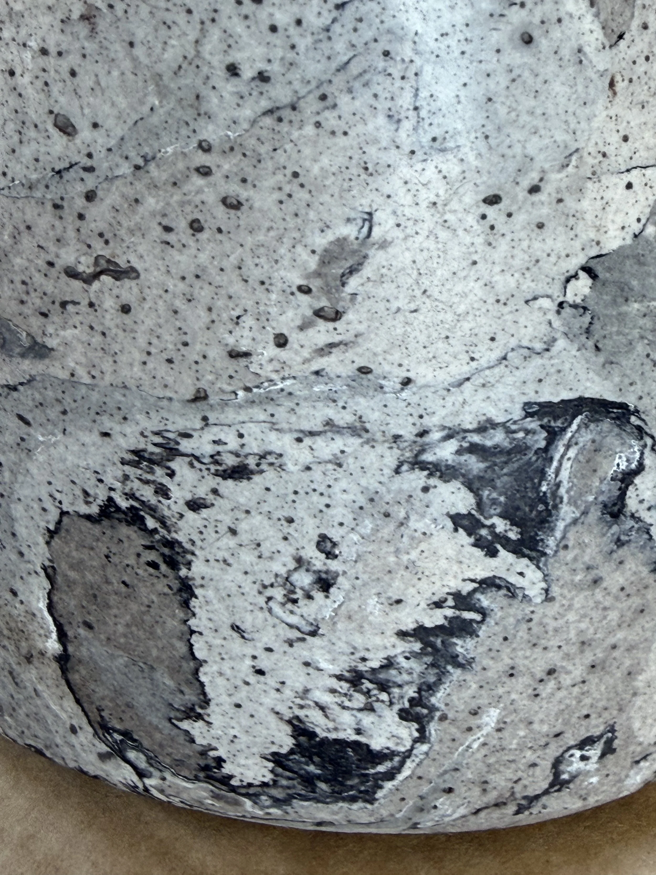 Close detail of the Gray Marble Table Lamp base showing charcoal veins across the pale marbling