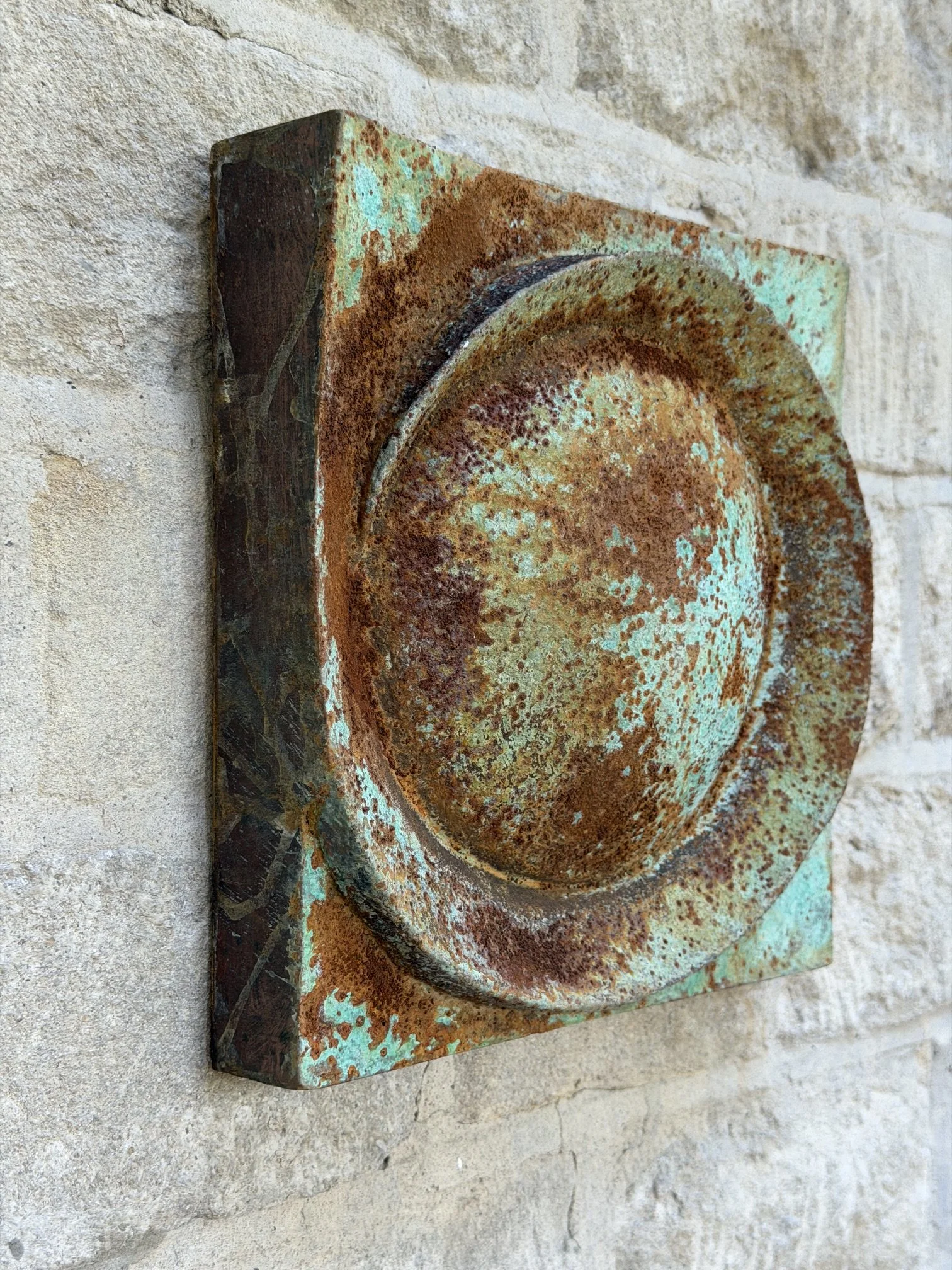 Moon Crater Phase Verdigris Spherical Wall Sculpture viewed from the side, showing the depth of the panel