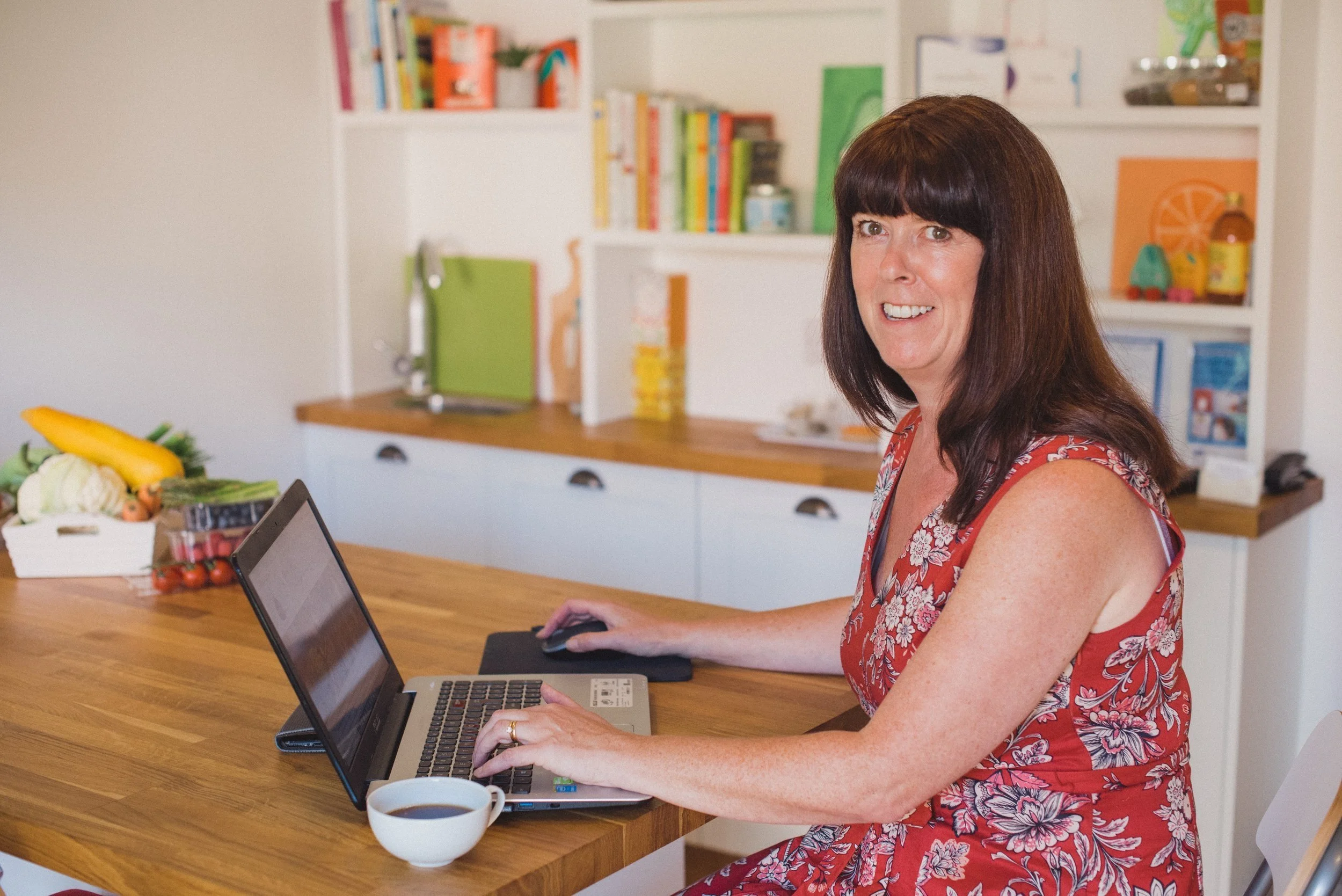 Wendy Hills, Nutritional Therapist typing at her computer