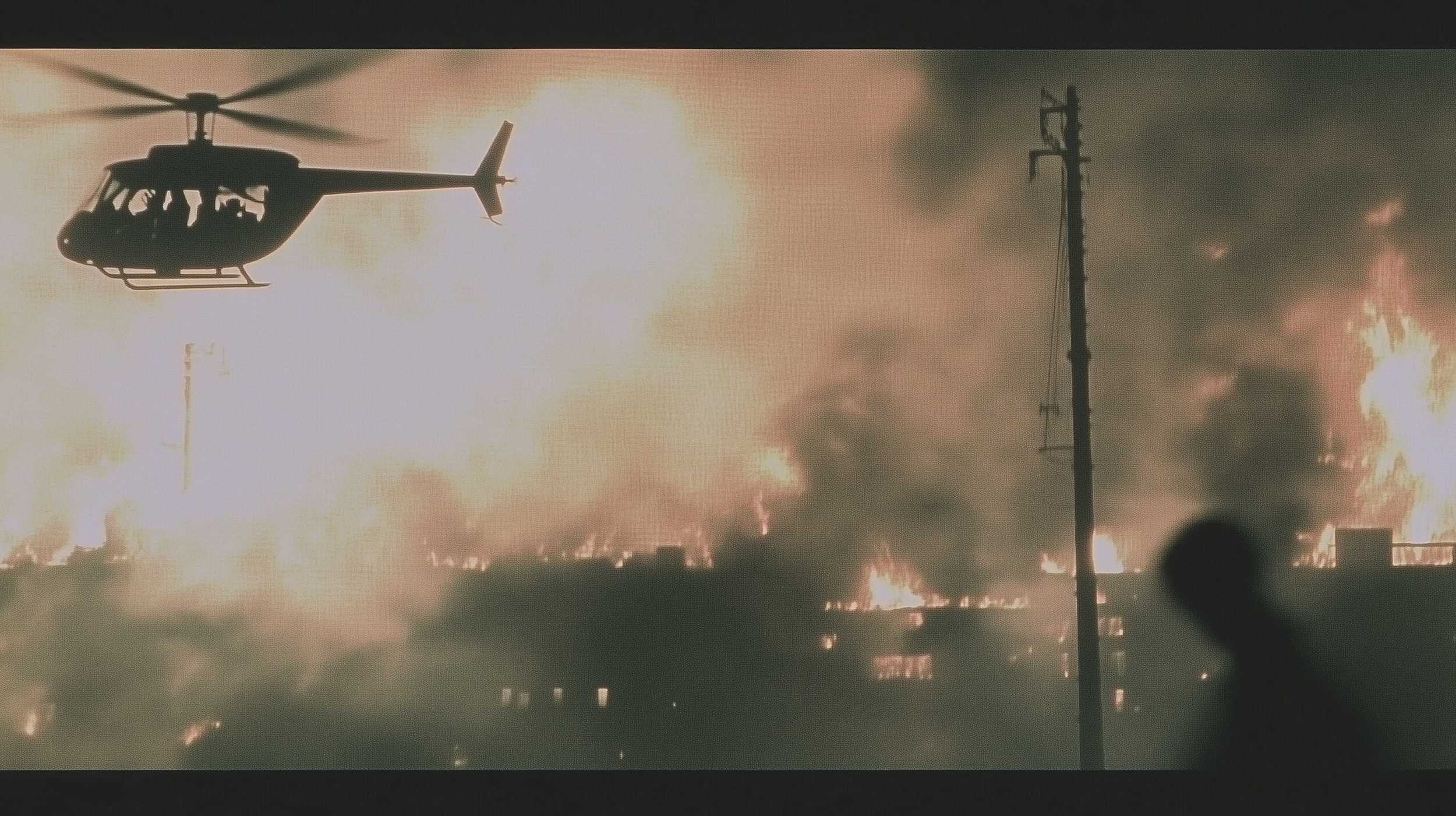 smee06538_a_helicopter_flying_through_a_city_on_fire_--ar_169_-_39e2ec76-cb85-4b15-9f30-ac22531d7b54.png