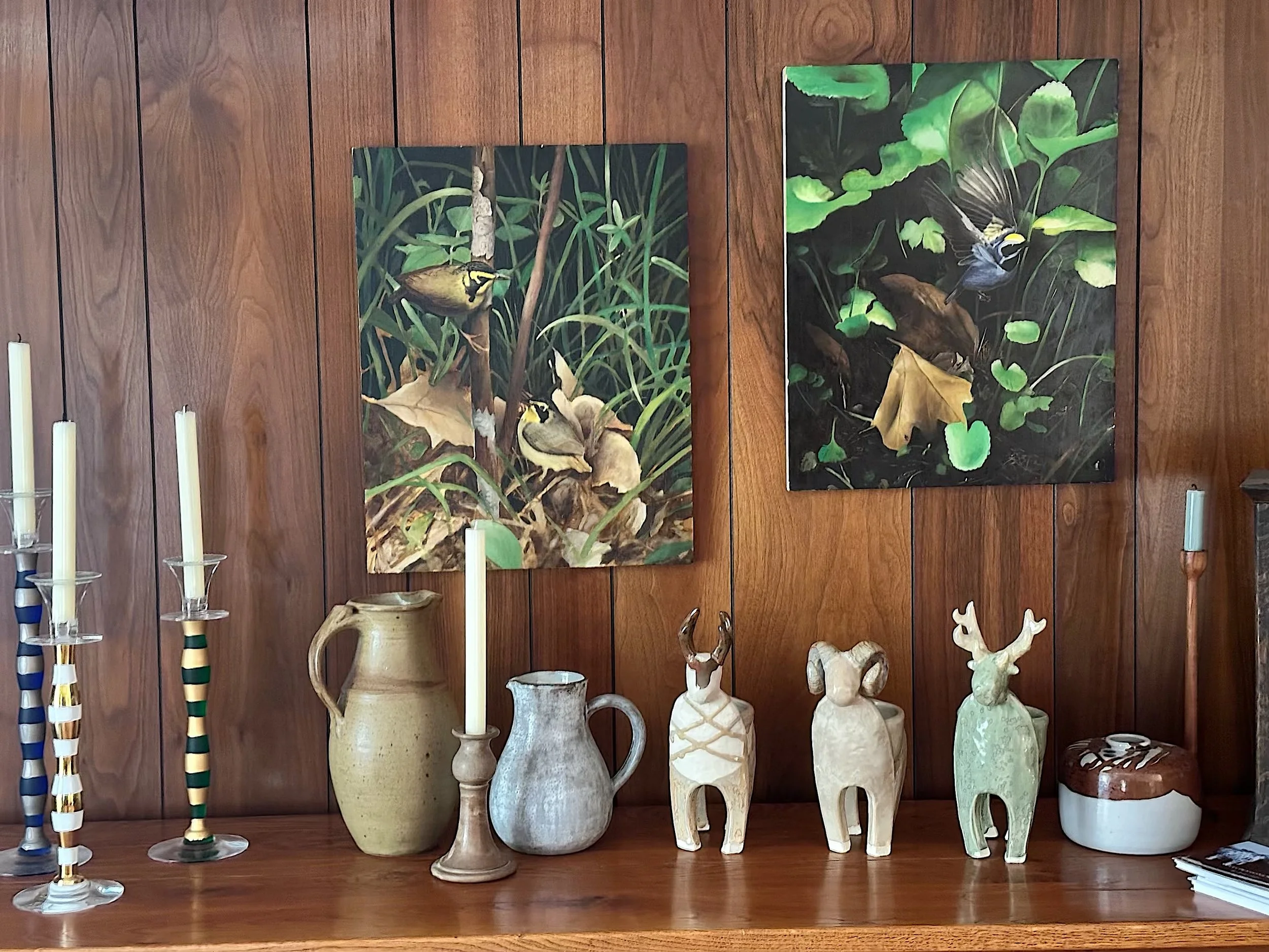 Installation view of Jesse Fales wildlife ceramics with bird paintings by Chris Pfister at Contemporary Western Arts in Cody, Wyoming.