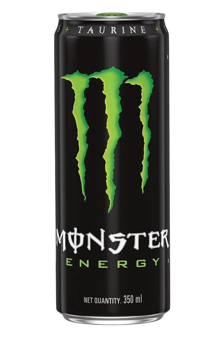A can of Monster energy drink, which has black wrapping and a stylized, grungey M colored green in the middle.