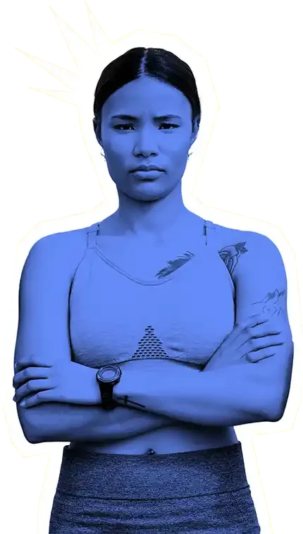 Femalte athlete with a serious expression and crossed arms wearing sports attire.