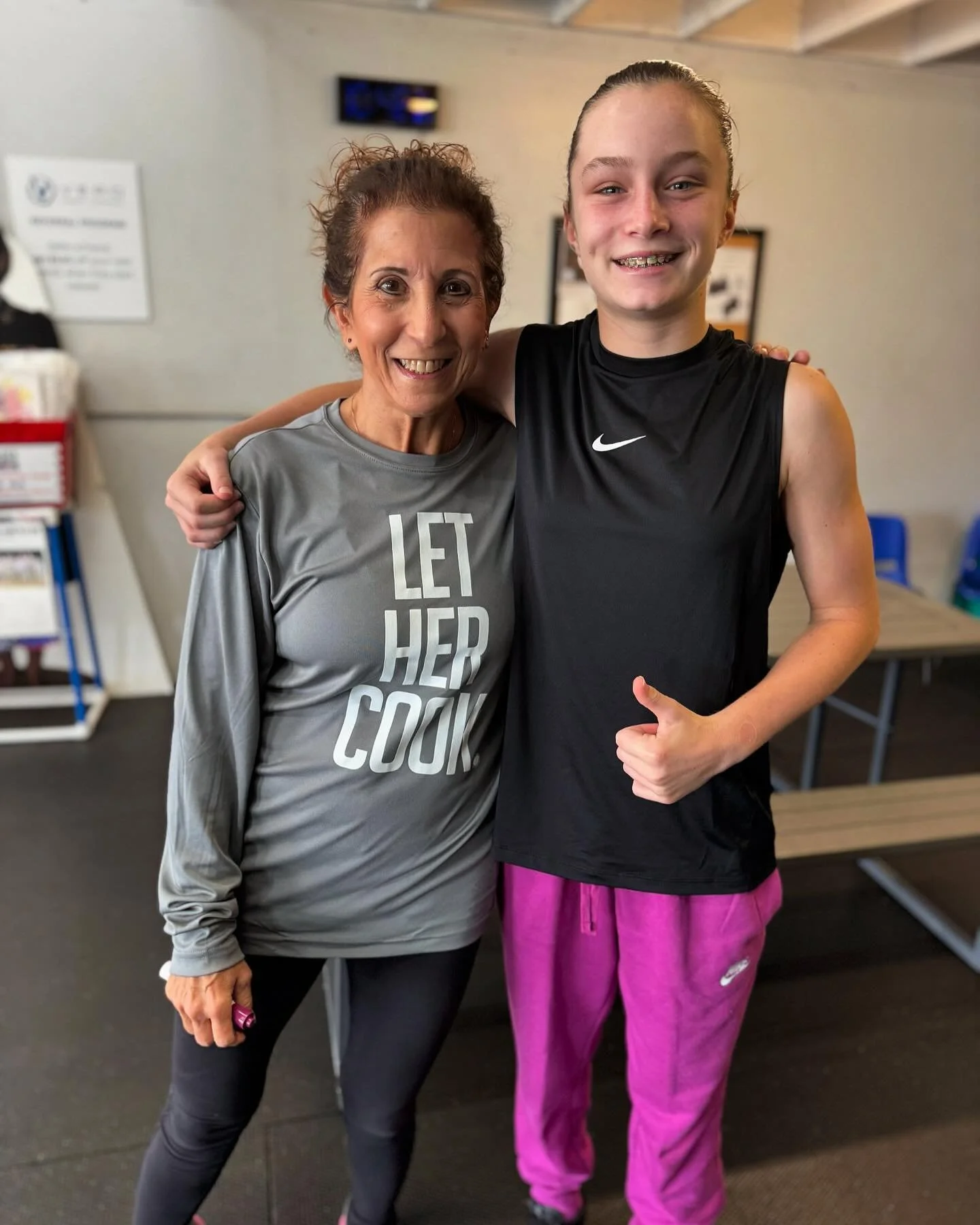 @ginakarshner22 rocking the long sleeve gray shirt and me doing a burpee with Lacy at @besundaystrong class🫶🏻🥳💚 #lethercook