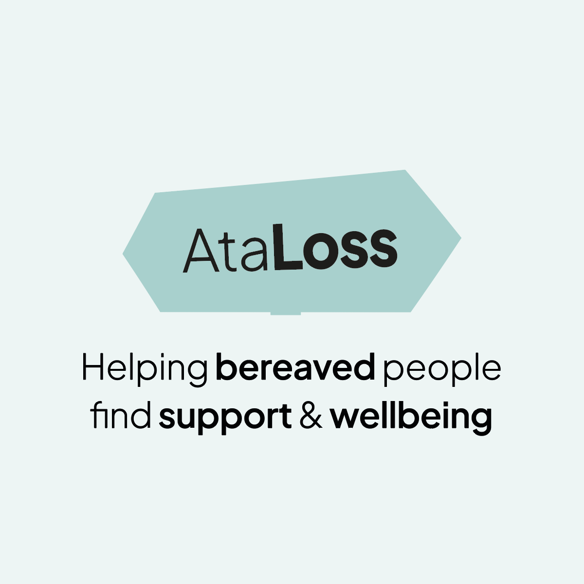 Portrait of a smiling man woman with short brown hair, wearing a navy shirt.