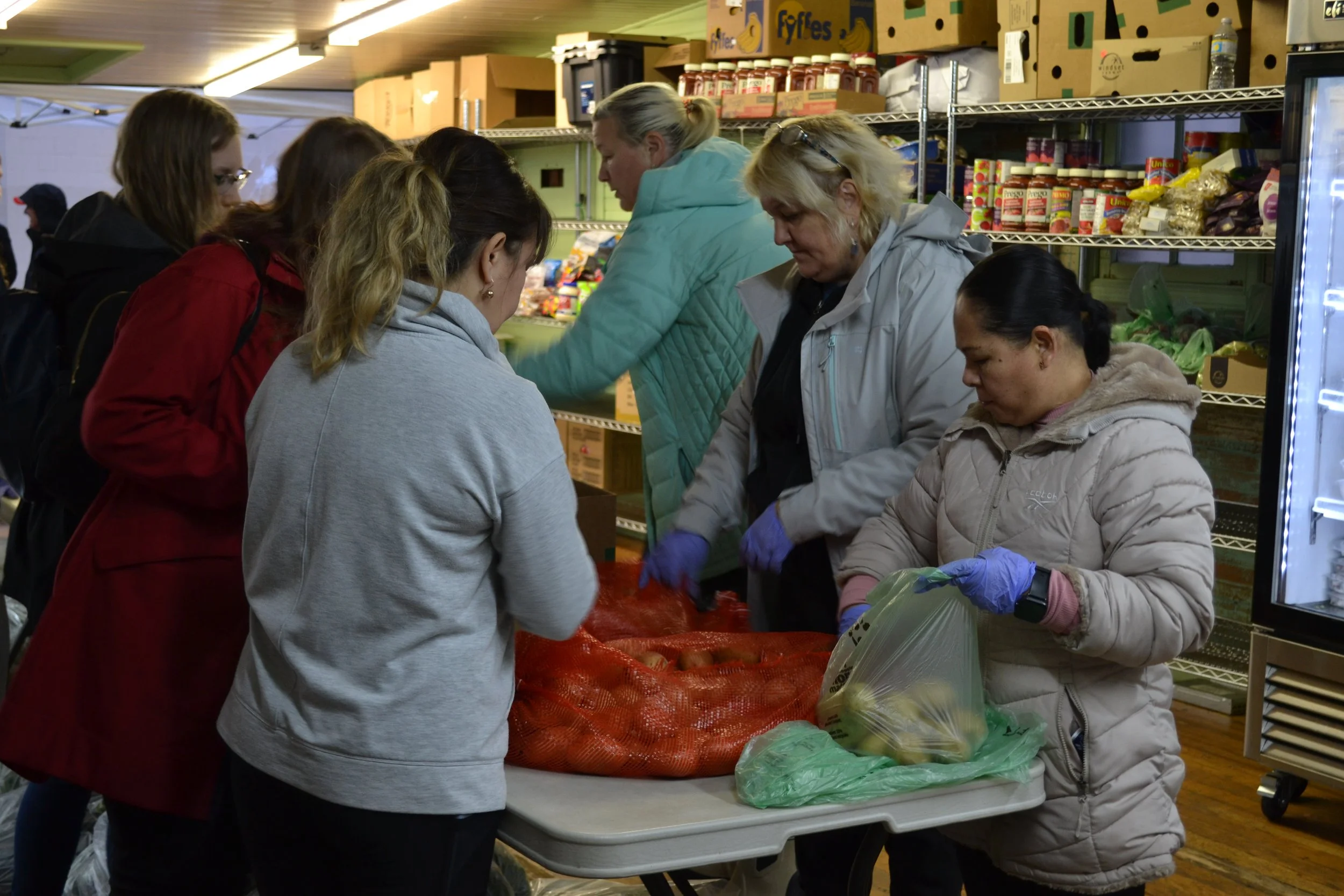 Volunteers sorting donated groceries at Raphael House in Langley BC