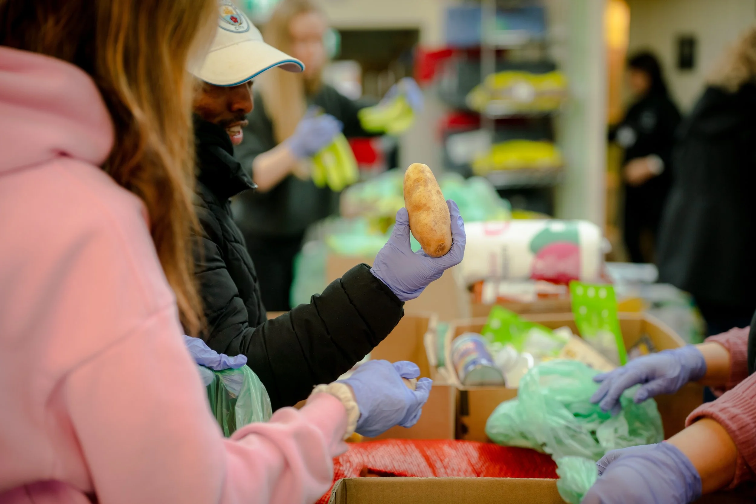 Volunteers sorting donated groceries at Raphael House in Langley BC