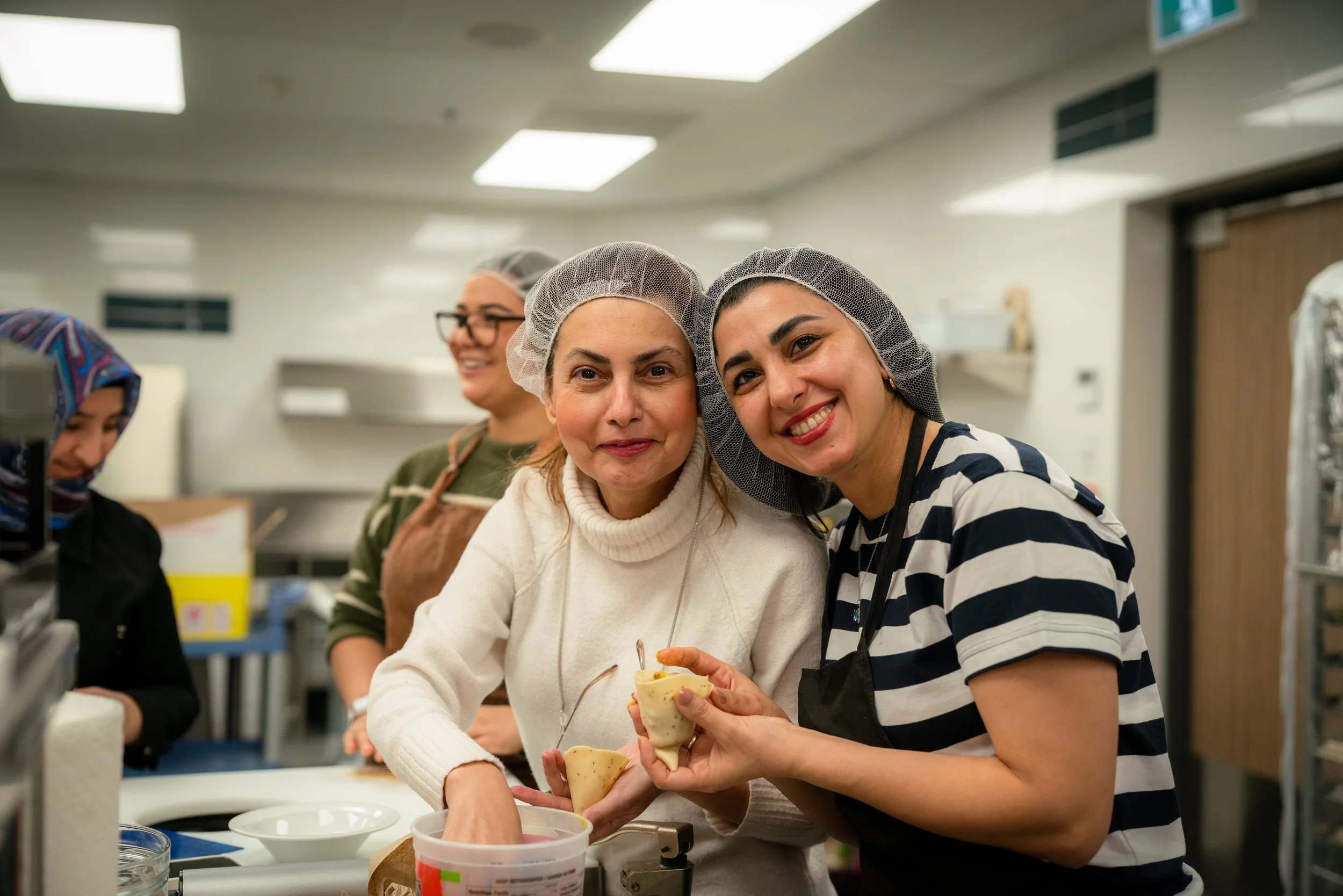 Raphael House volunteers distributing donated groceries in Langley