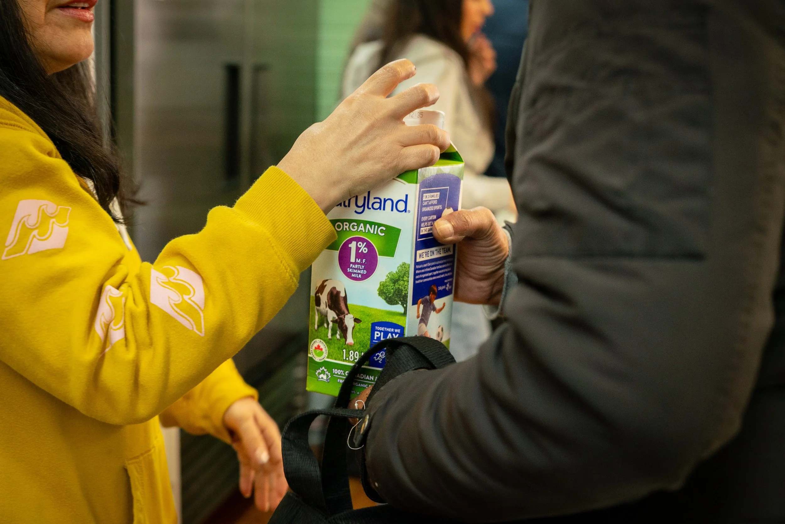 Family receiving weekly groceries at Raphael House food hub in Langley BC