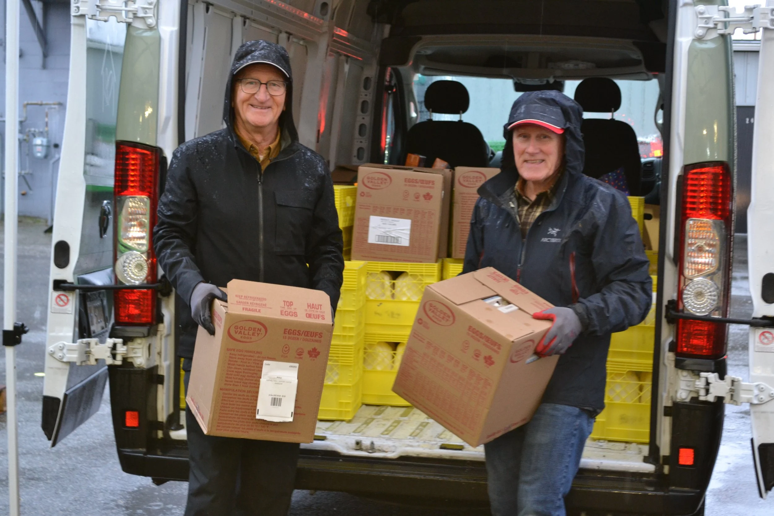 Raphael House volunteers serving families at the Langley food hub