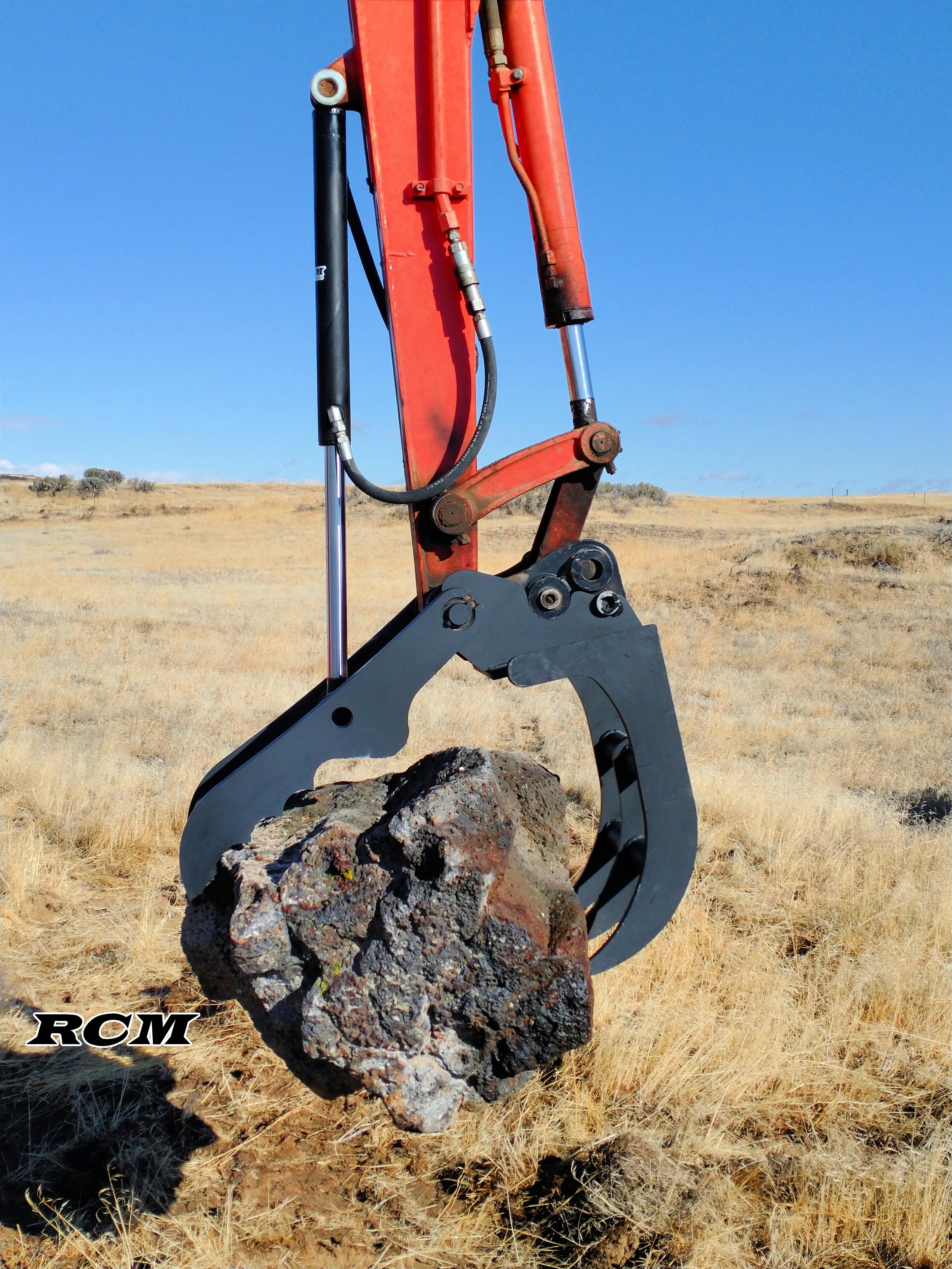#4 Kubota Claw bucket rock copy.jpg