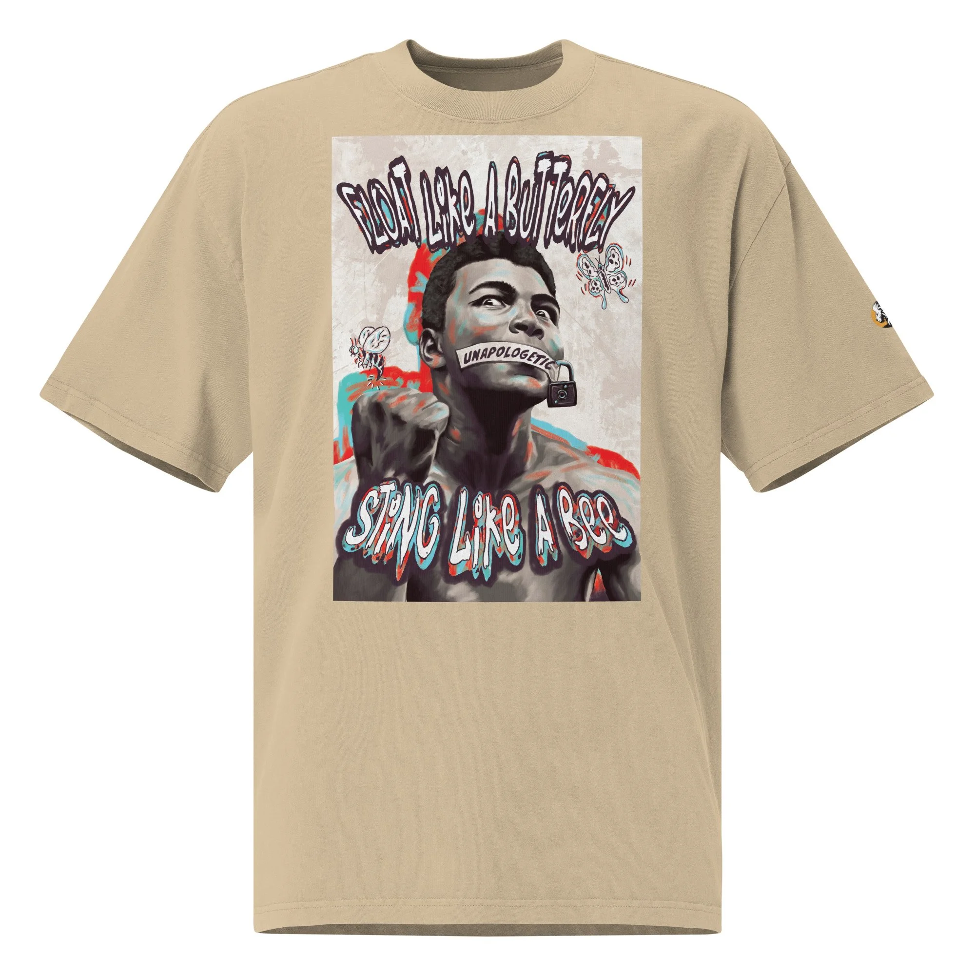 Oversized faded beige T-shirt with a Muhammad Ali graphic, featuring 'Float like a butterfly' text, a stylized portrait, and symbolic imagery.