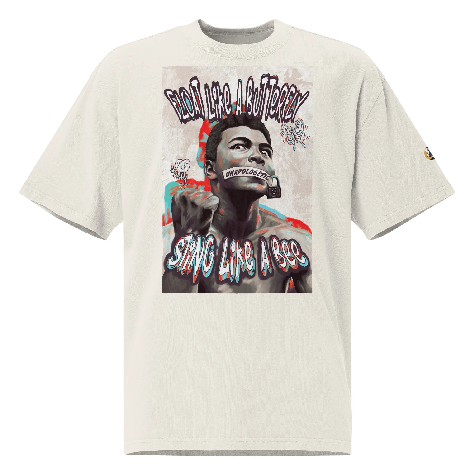 Oversized faded bone T-shirt with a Muhammad Ali graphic, featuring 'Float like a butterfly' text, a stylized portrait, and symbolic imagery.