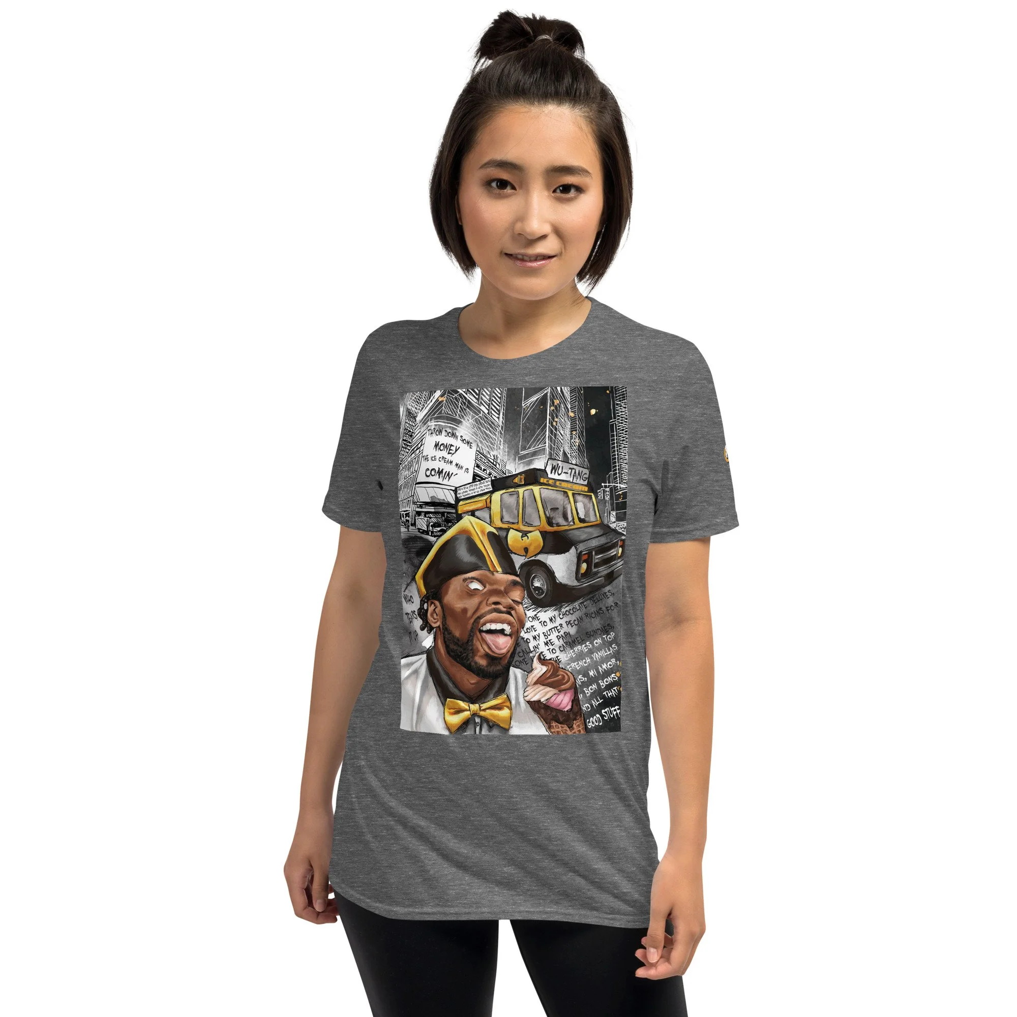 Woman wearing a heather gray T-shirt featuring a colorful graphic of a man with a yellow bow tie holding ice cream, in front of a Black and Gold-themed ice cream truck and urban cityscape background.