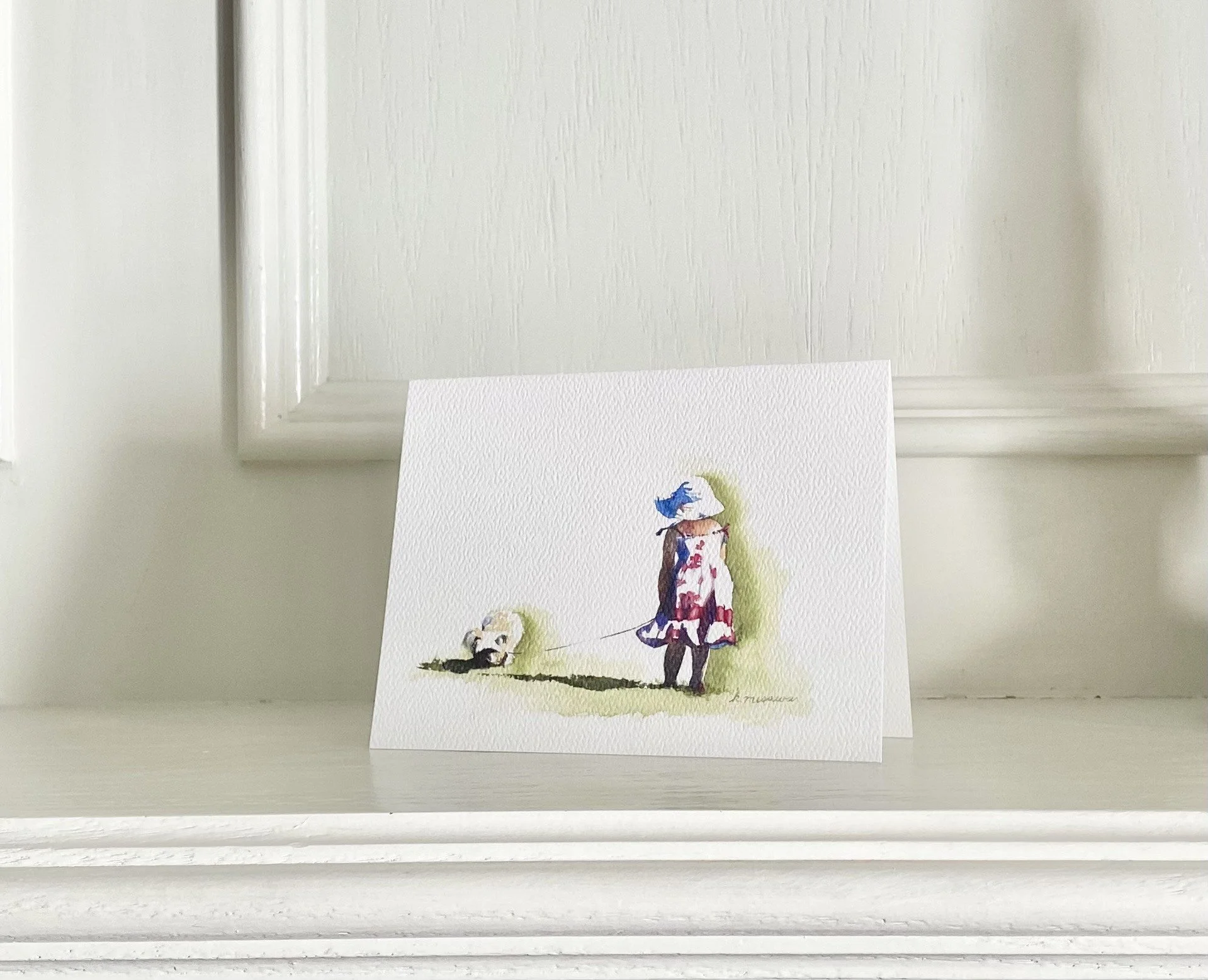 watercolor print greeting card of little girl in dress walking a dog by Keri Misawa