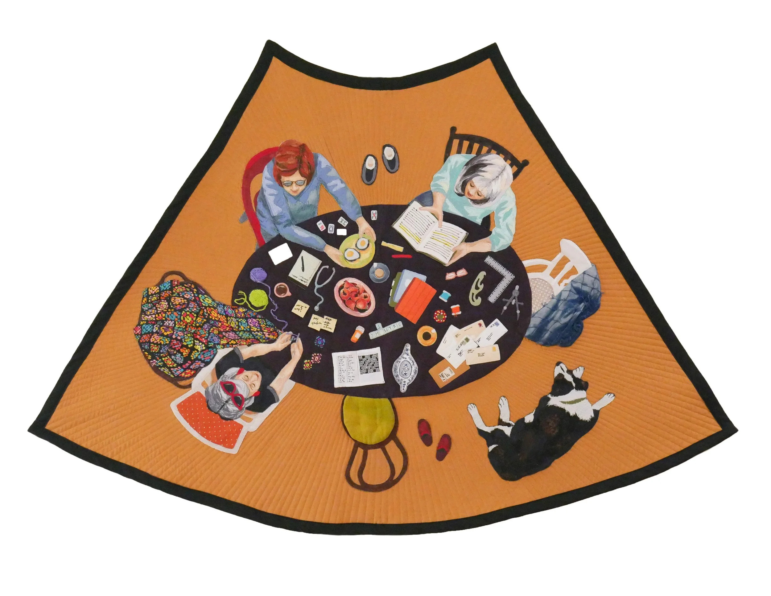 A quilt of an overhead view of three women sitting around an oval table covered in craft materials against an ocher background.