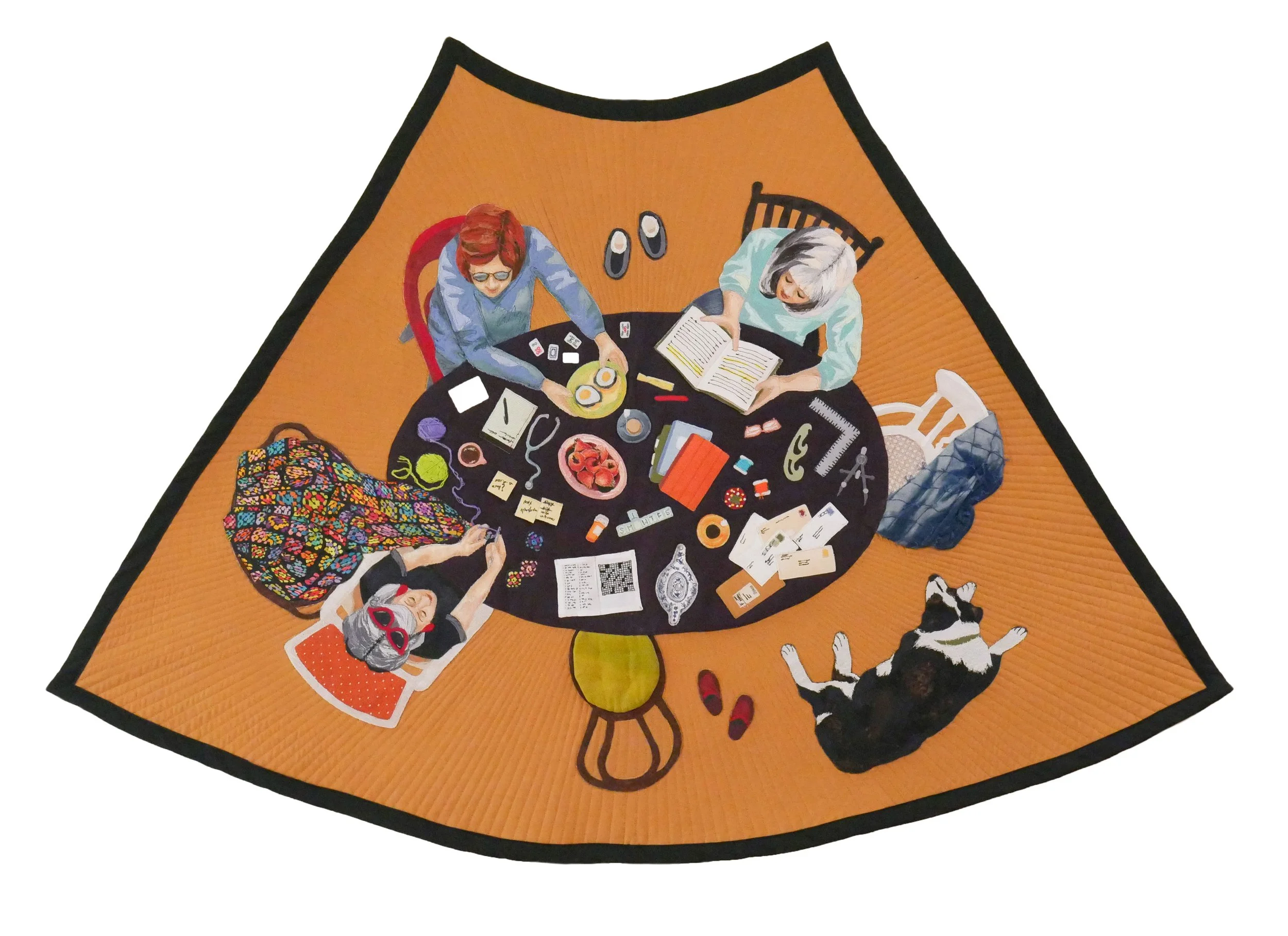 A quilt of an overhead view of three women sitting around an oval table covered in craft materials against an ocher background.