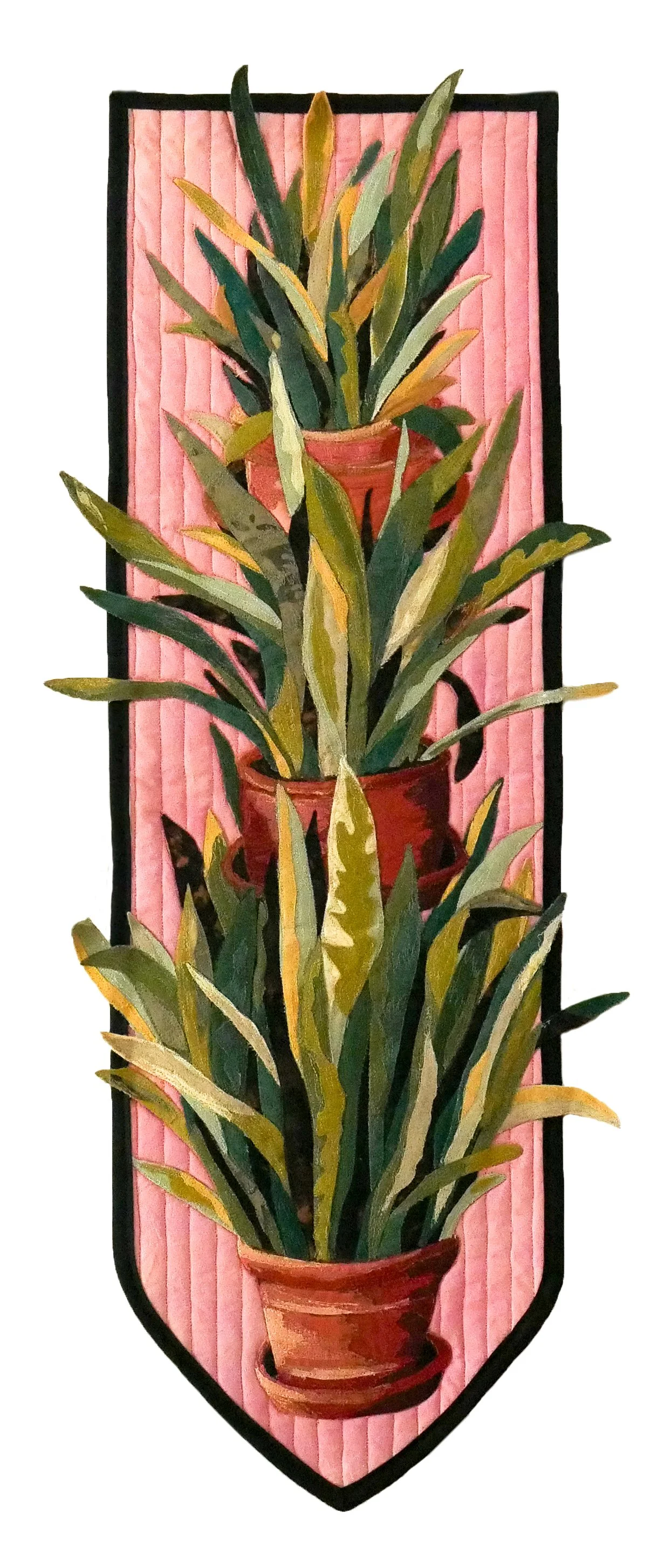 Applique quilt of three potted snake plants stacked vertically against a pink background