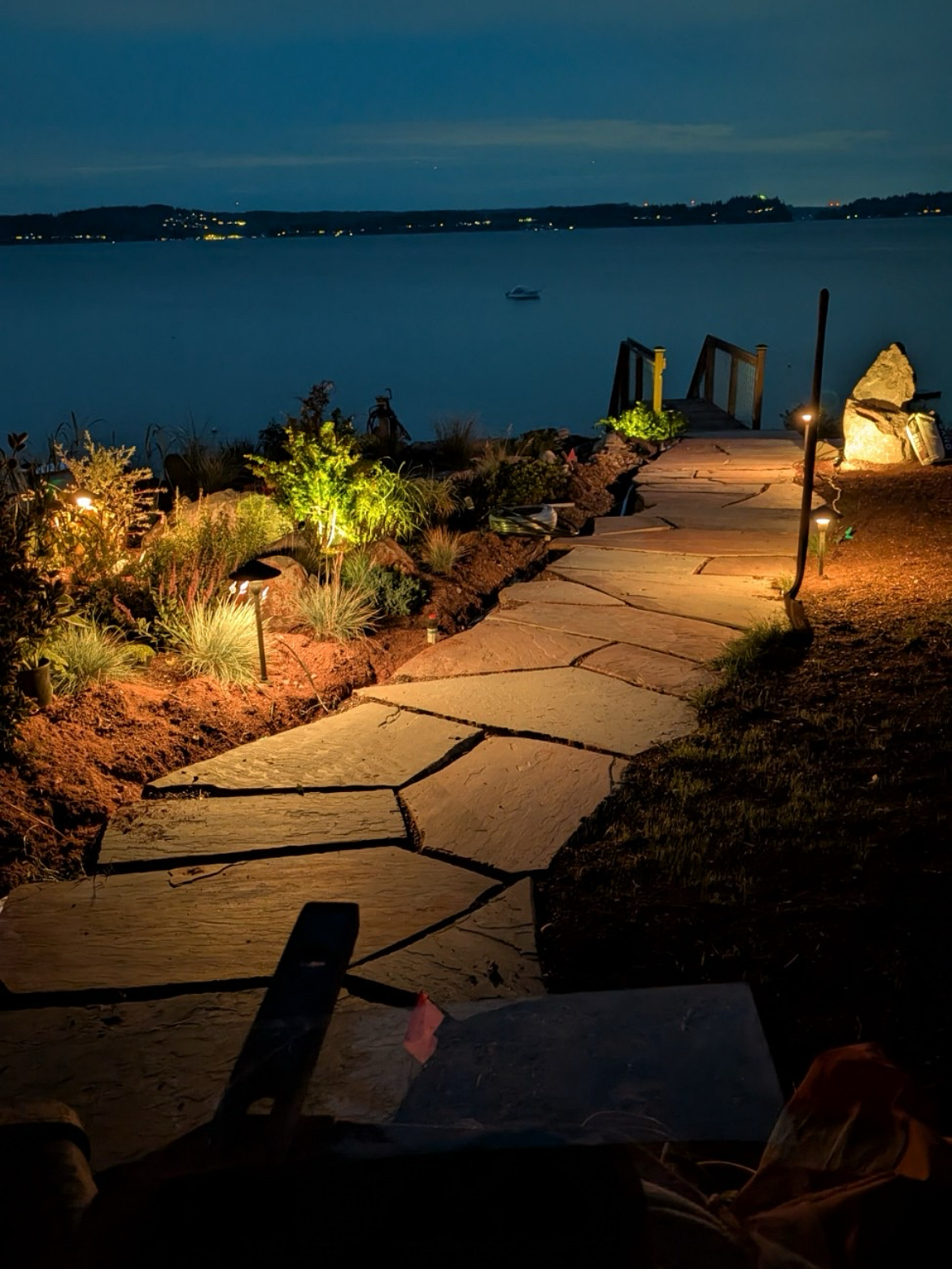 A bluestone path in Gig Harbor with outdoor lighting, crafted by 7 Lamps Construction (Gig Harbor). www.7lamps.com