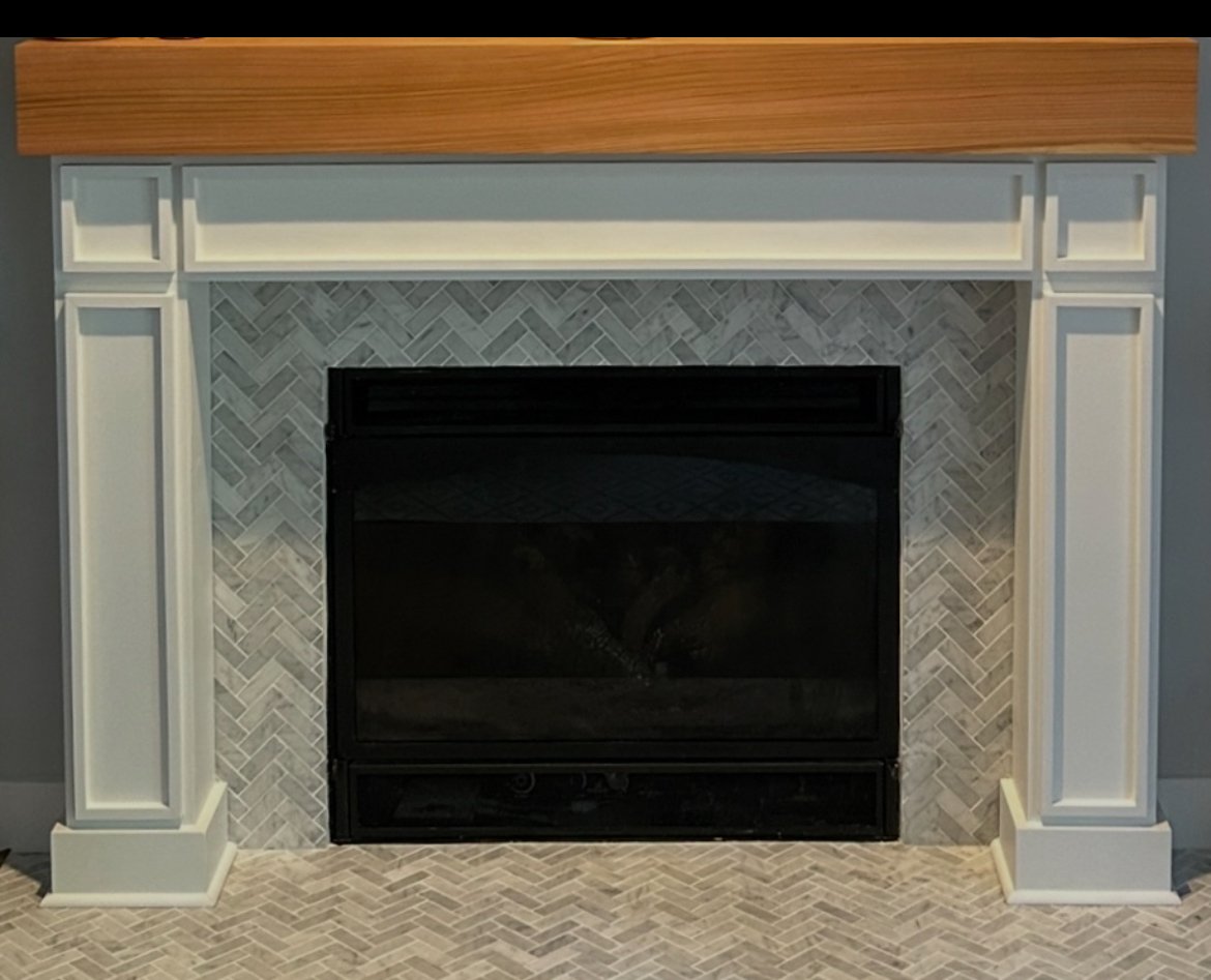 Fireplace remodel with custom mantle in Gig Harbor crafted by 7 Lamps Construction (gig Harbor). www.7lamps.com