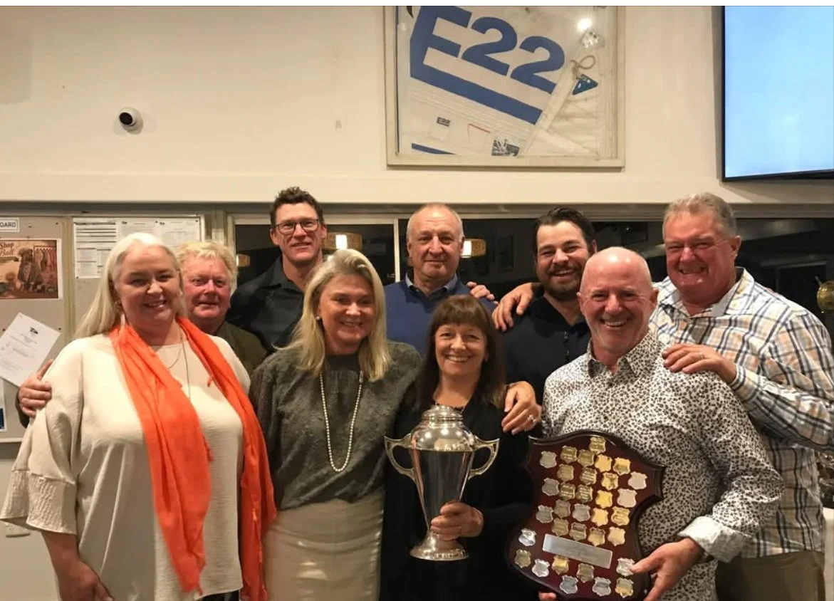 The crew of Etchellente - Peta Smith, Phil Grundy, Dean Smith, Julie Foster, Stephen Richardson (co-owner), Annie Richardson (co-owner), Jack Richardson, Ian Cameron and Damien Daniel (helm) - with the Commodores and Norman Strange trophies, which th