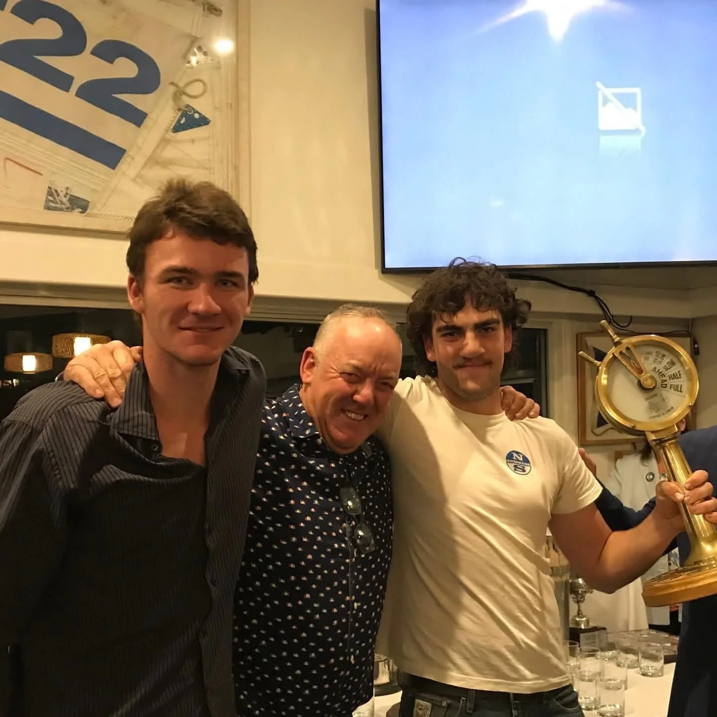 Wayne Smith, Rod Edwards (owner) and Charlie Edwards (helm), with the Hood 23 Series trophy they were awarded on Saturday at Metung Yacht Club’s senior fleet presentation dinner, for their performance on board Compass Rose during the 2025-2026 sailin