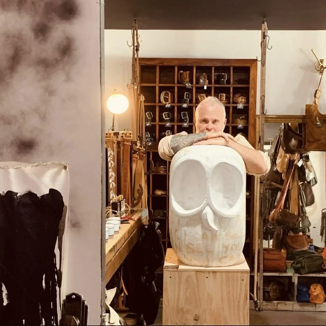 Jason Pevreall Art  standing with sculpture