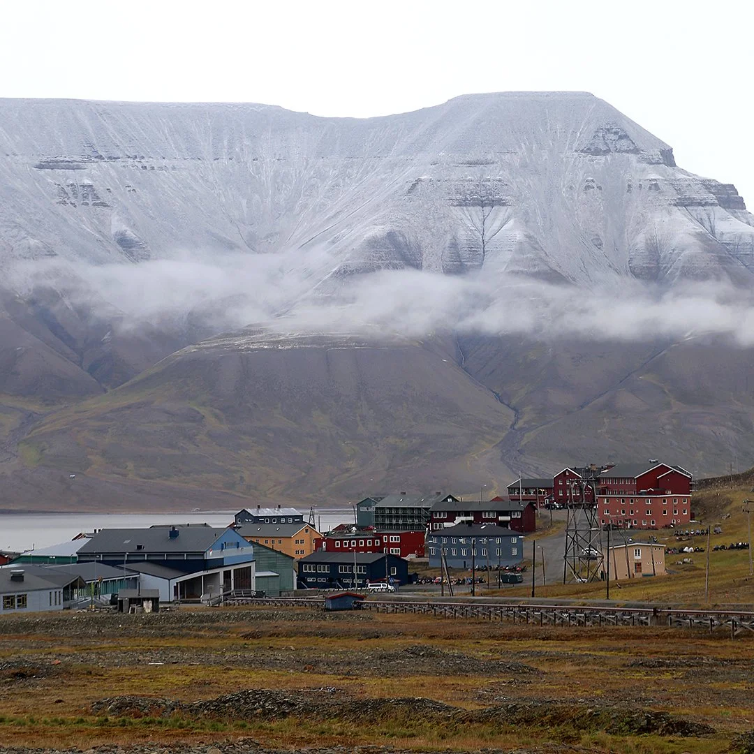 Snow on the mountaintops across the fjord from Longyearbyen