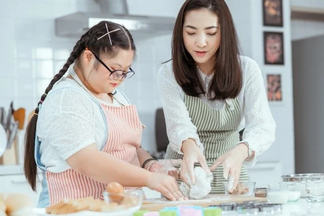 Occupational therapist supporting client with daily living skills retraining