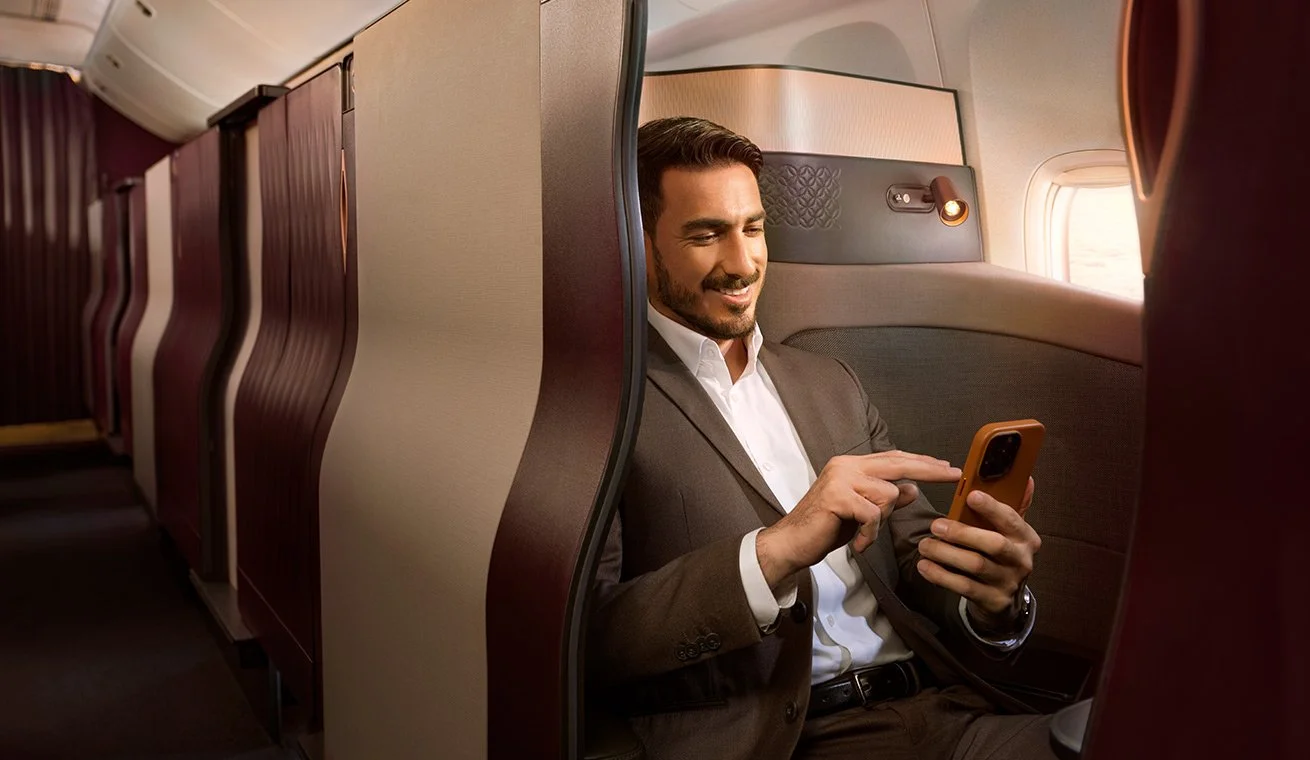 h2-Qsuite-Male-holding-mobile.jpg