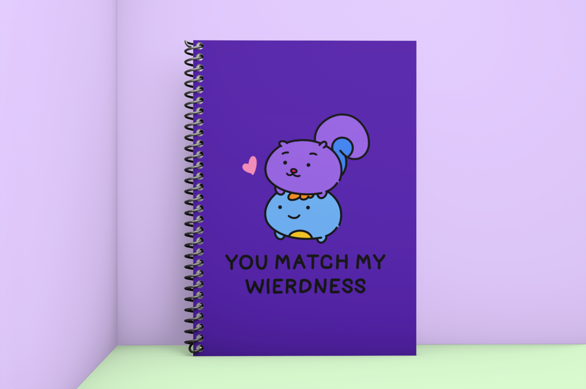 mockup-of-a-spiral-notebook-placed-against-a-two-tone-background-1007-el (1).png