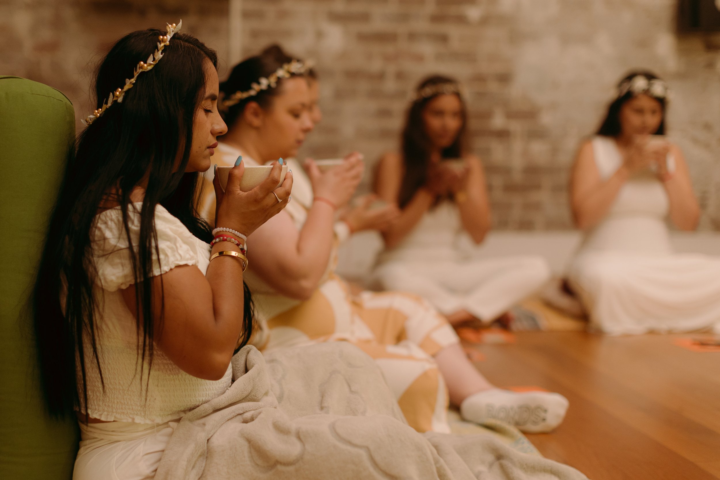 Women gathered in a ceremonial cacao circle for events and rituals