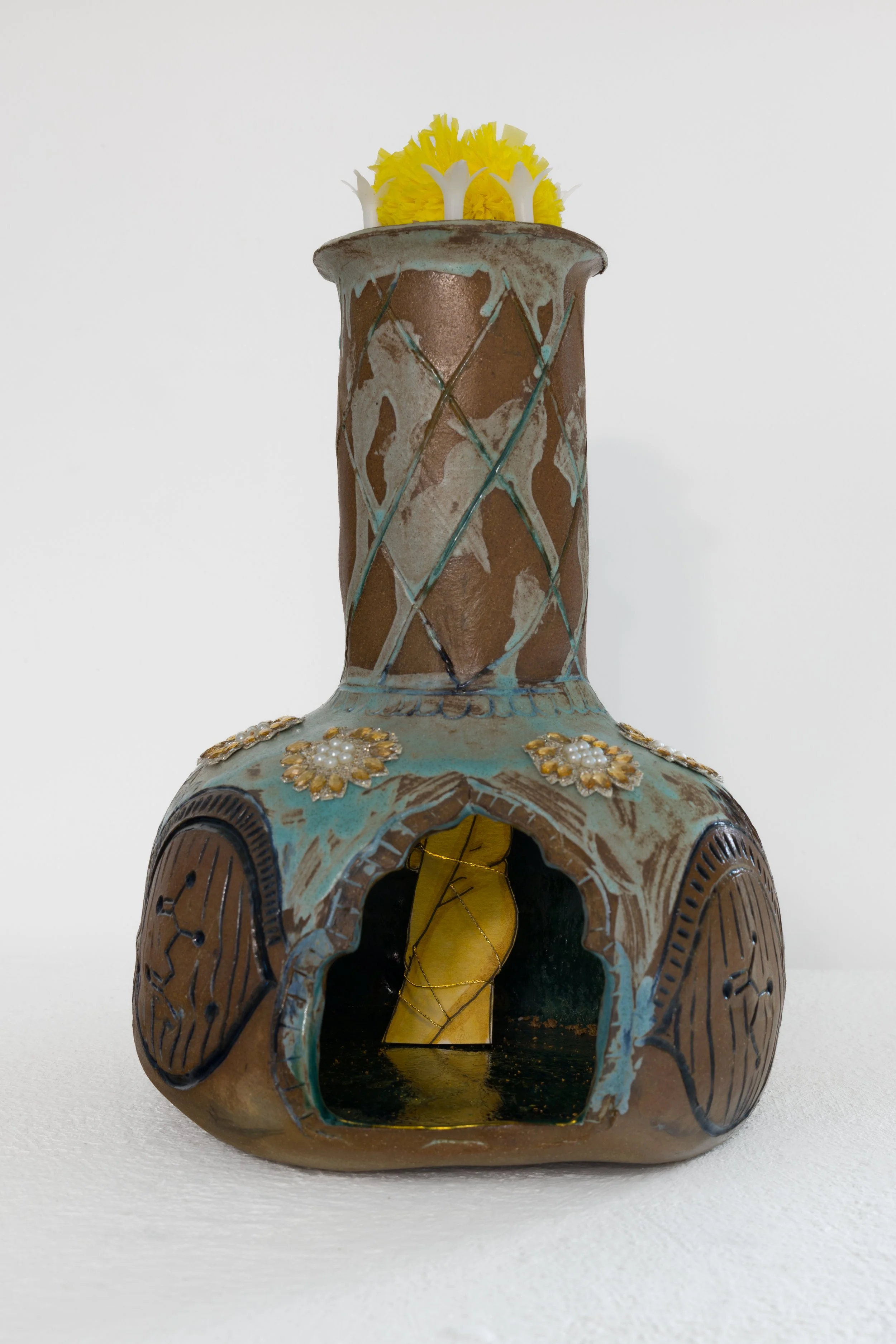 She is Hiding
Mixed media (ceramic, watercolor, textile, and found objects)
13” x 7”
2025