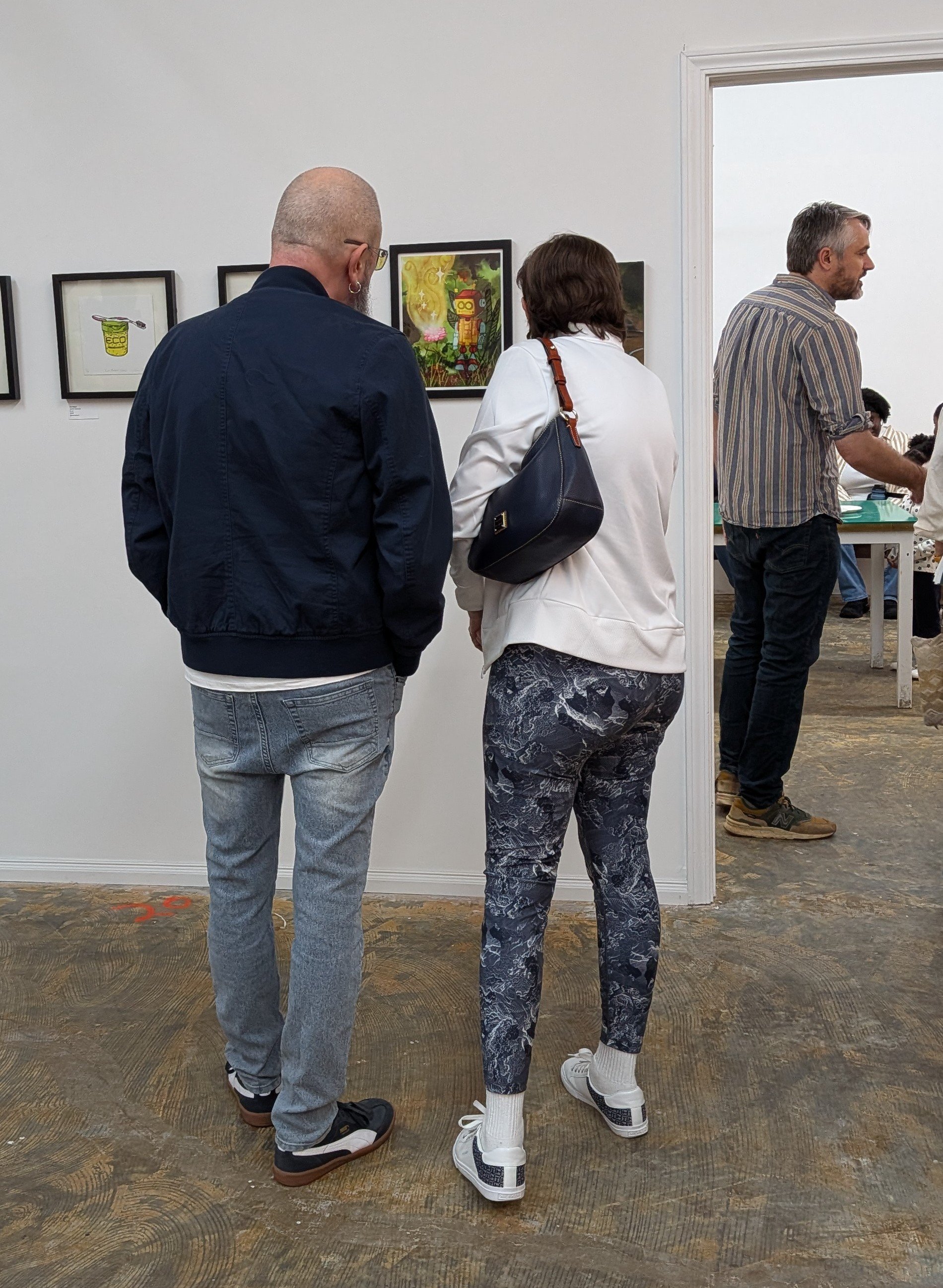 People viewing artwork in an art gallery
