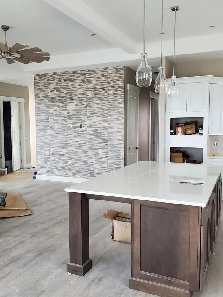 tile wall with open living and kitchen.jpg