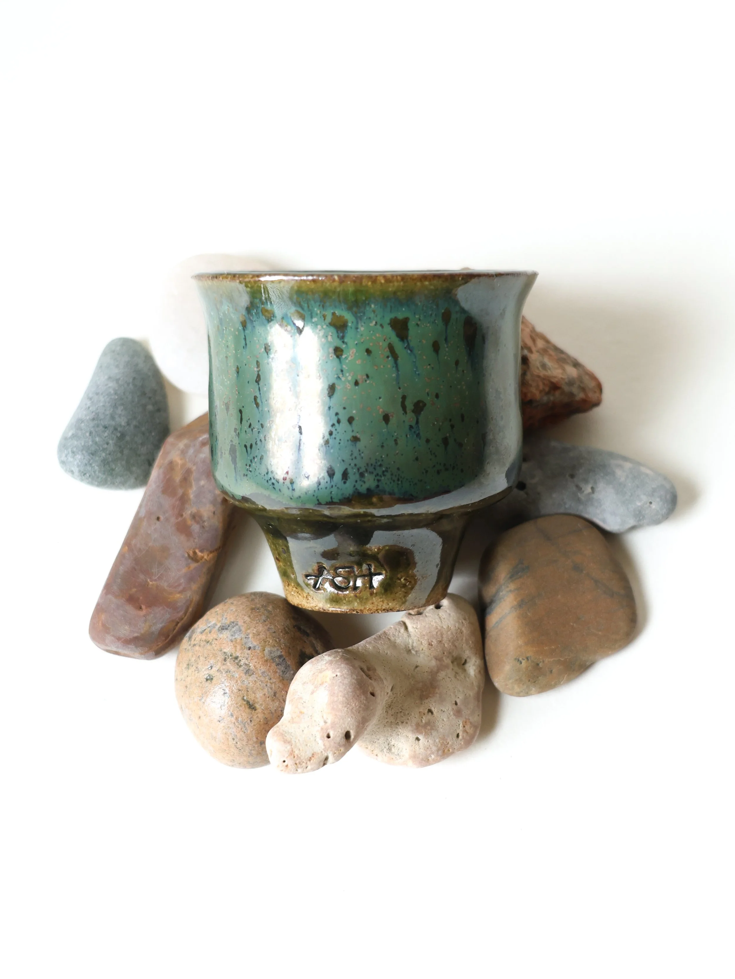 One handed cup with rocks, 2025