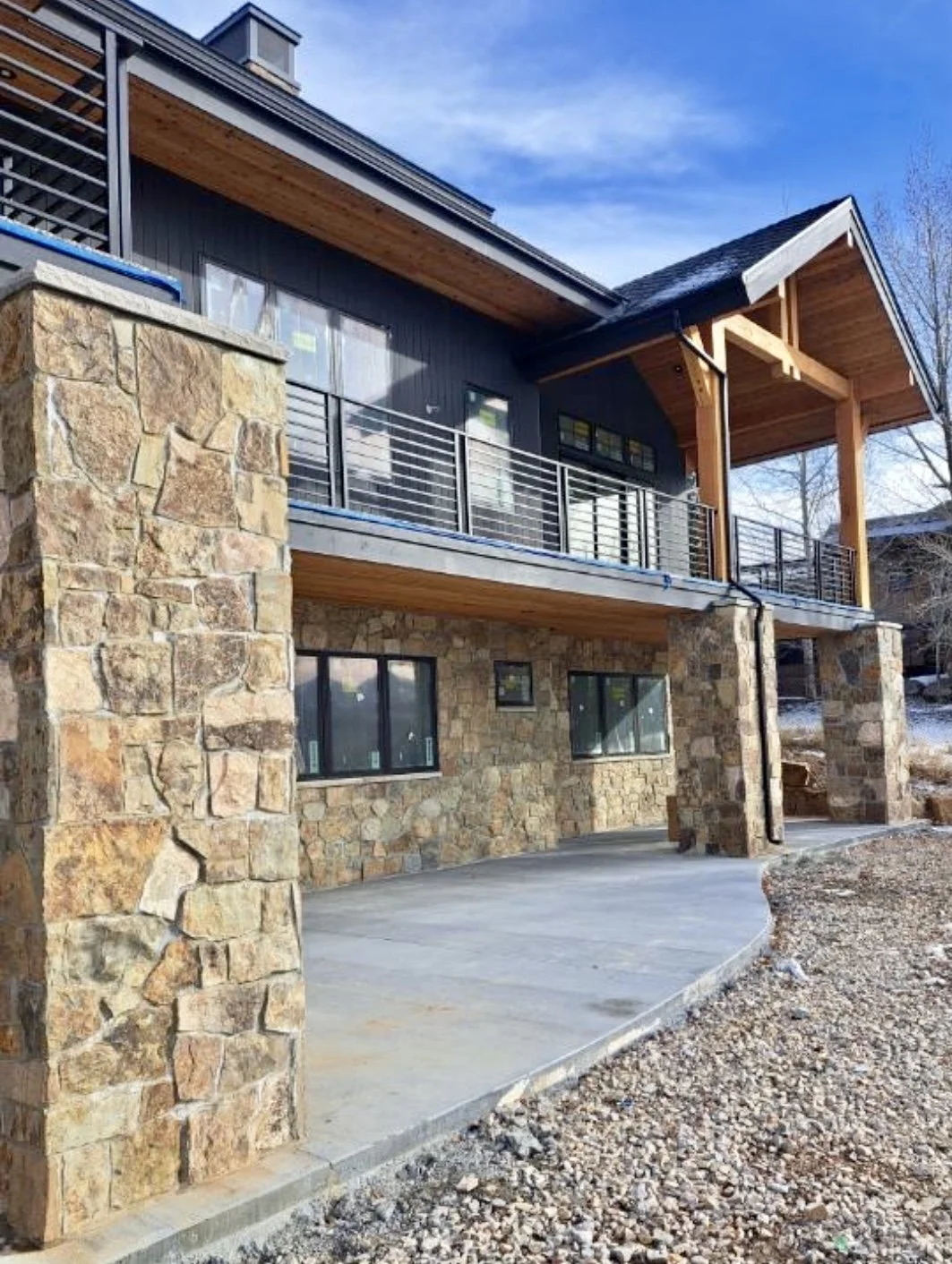 Natural stone column and wall finishes on a custom mountain home