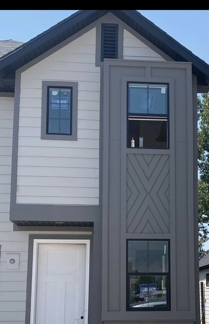 Modern Utah apartment development featuring vertical and horizontal siding, exterior panel systems, custom trim, soffit, and fascia, and board and batten.