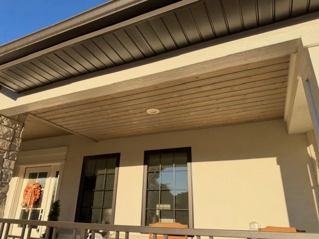 Stained cedar porch lid with black soffit front porch