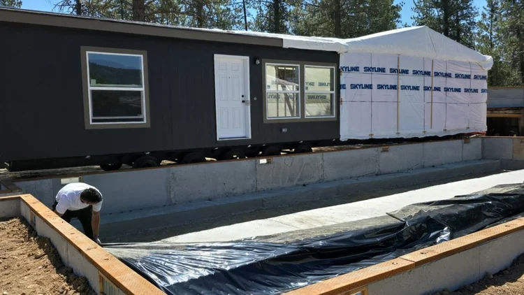 Modular building on wheels near foundation
