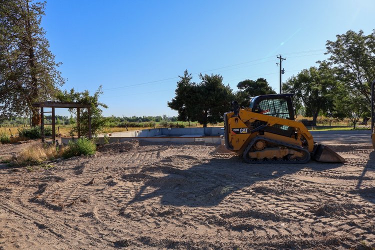 Compact loader on site