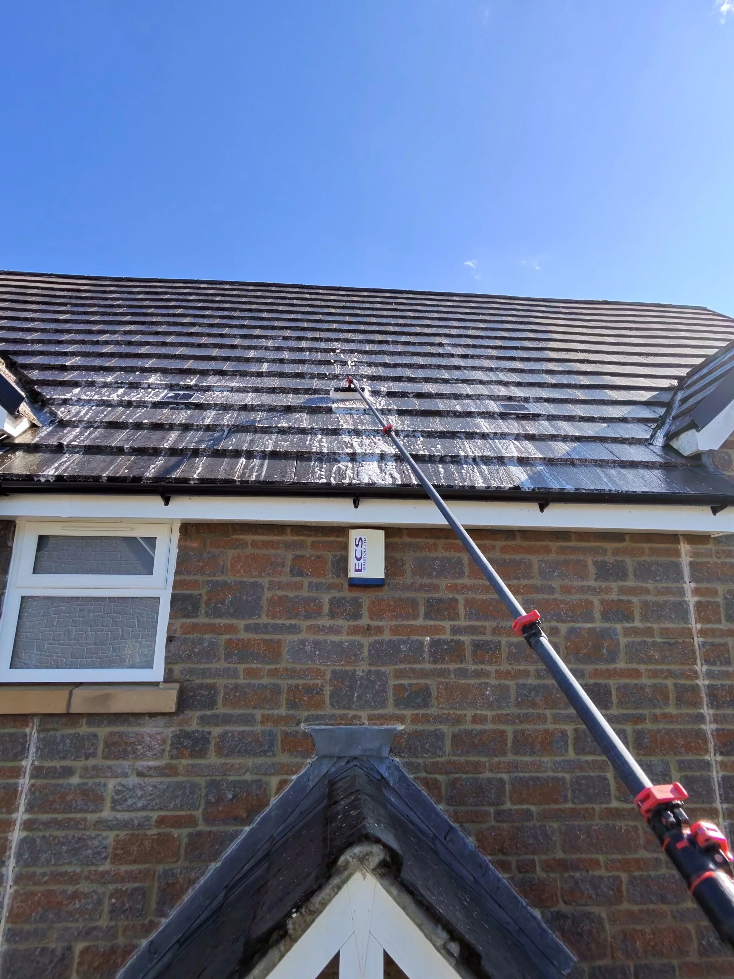 cpm_31.roof biocide treatment with brush.jpg