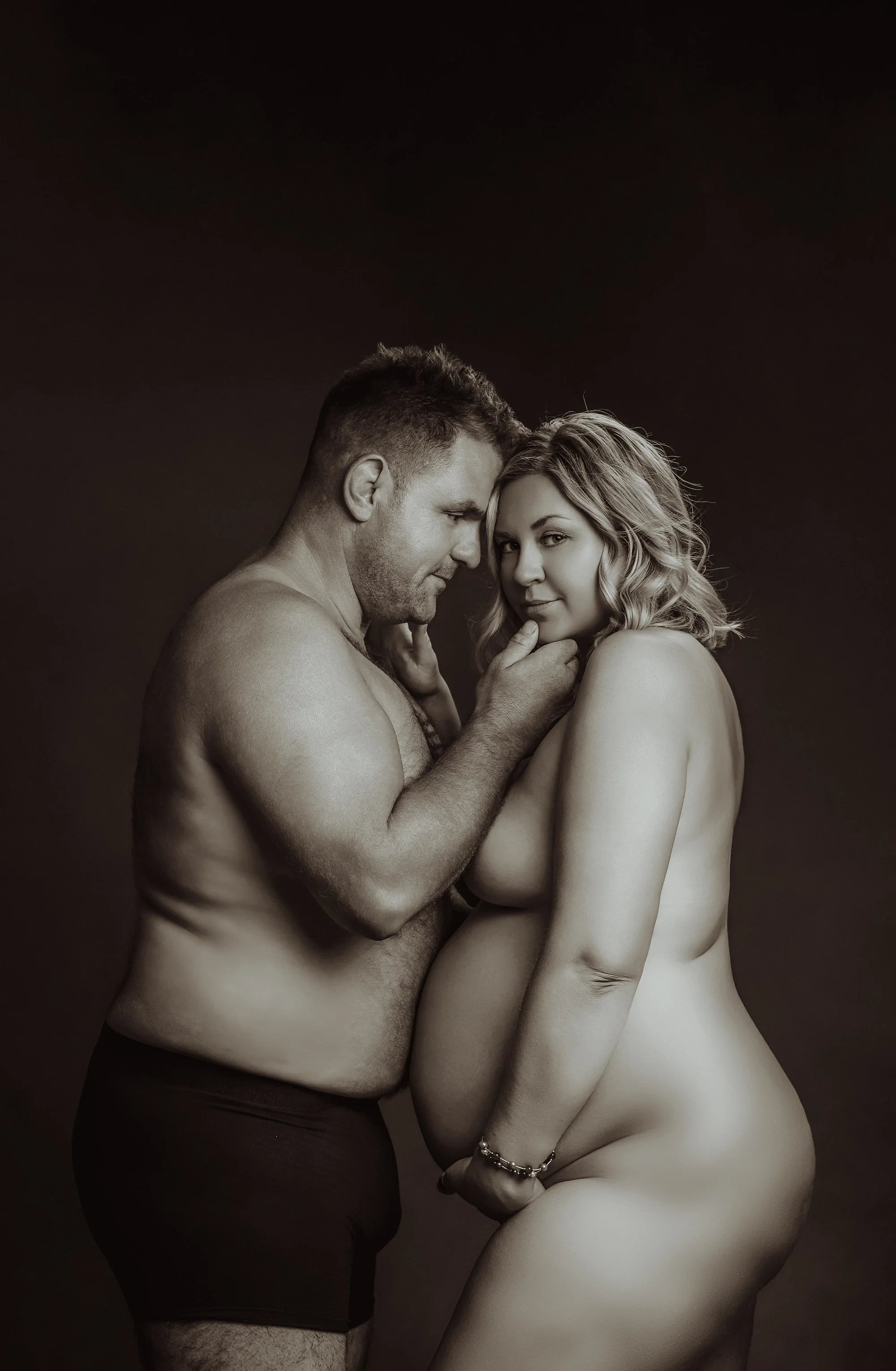 pregnant mother to be and her partner photographed at kath evans photography studio talgarth brecon mid wales