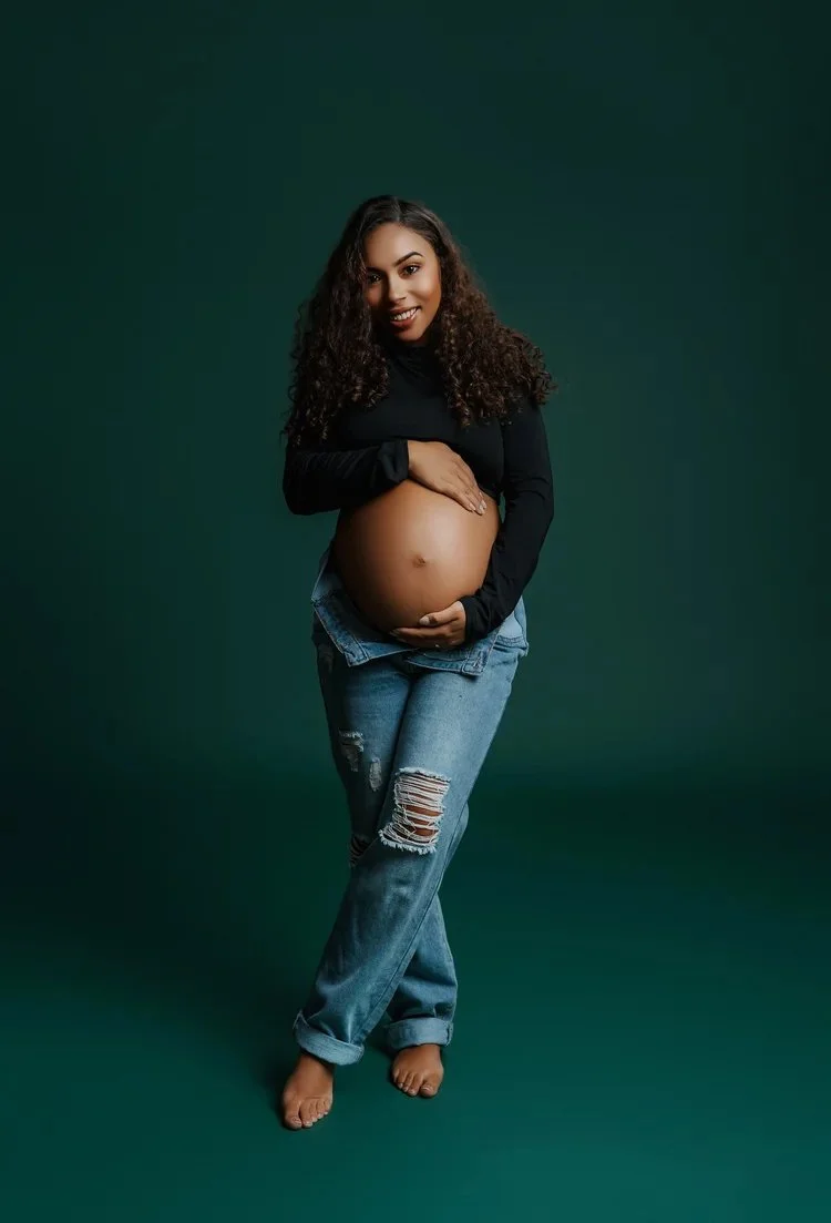 pregnant woman in brown dress photographed at kath evans photography studio talgarth brecon mid wales