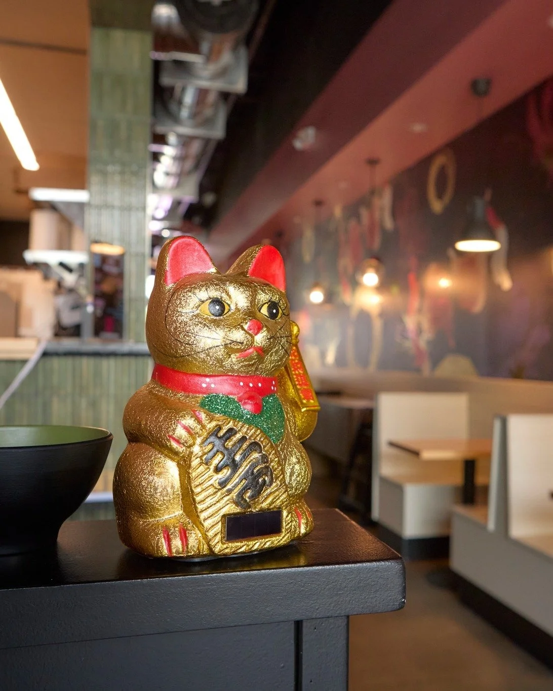 Come for the noodles, stay for the paw-sitive pours. 🍶🐱
Did you know a lucky cat, or Maneki Neko, is more than just cute? Traditionally placed near an entrance, it waves in good fortune, wealth, and all the good vibes. Consider this your sign to st