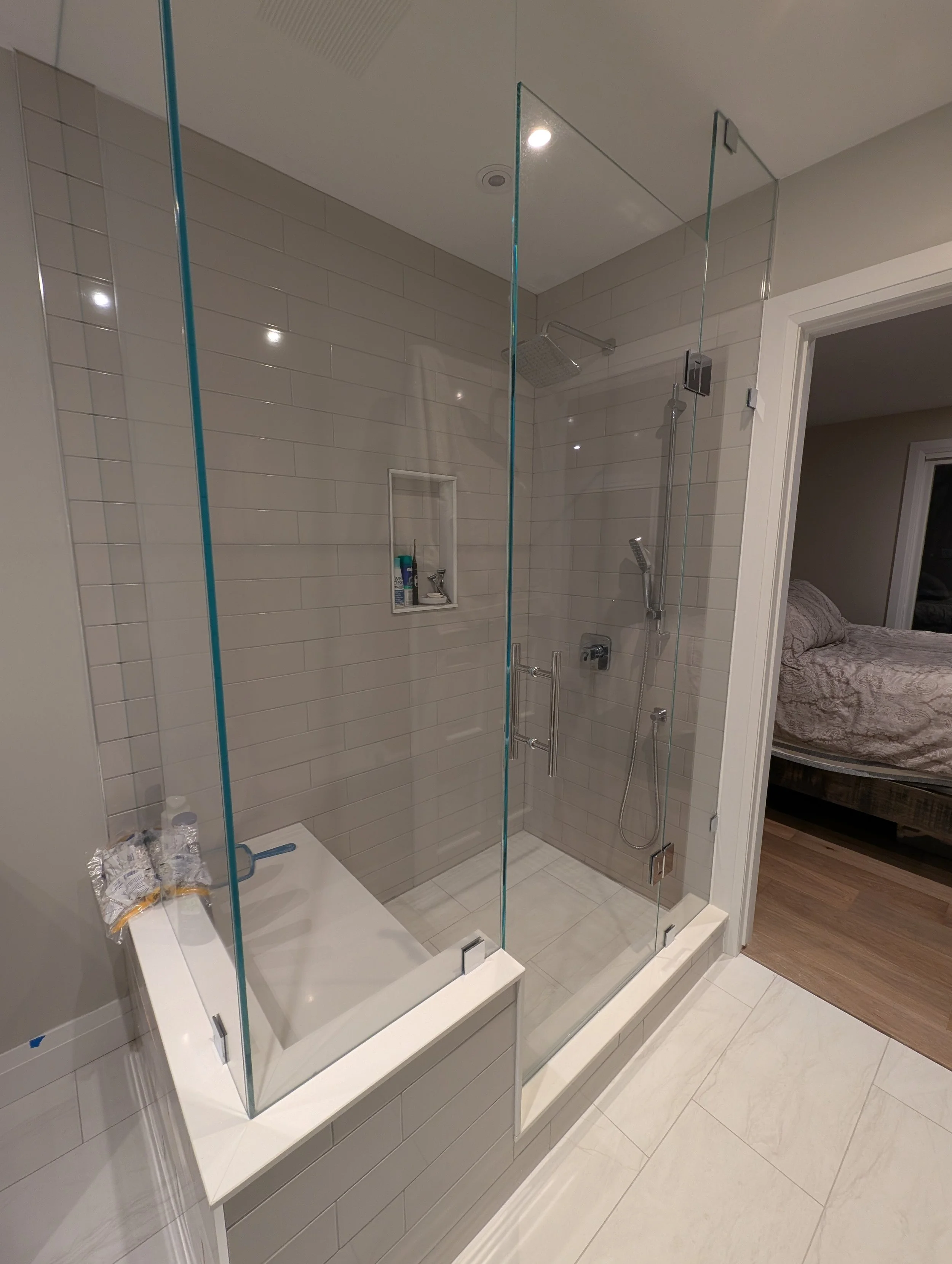 Custom walk in shower with shower bench and TruFire glass